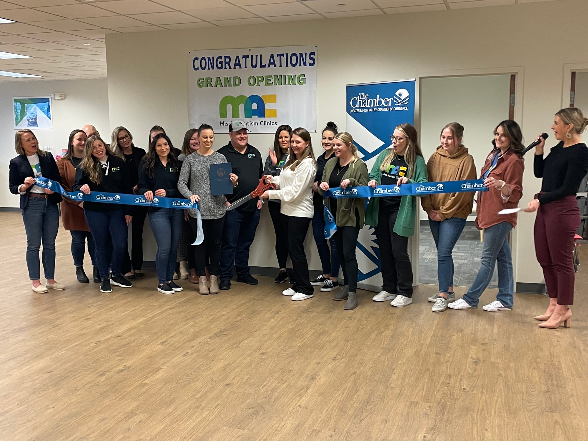 Mission Autism Clinic staff, as well as representatives from the Lehigh Valley Chamber of Commerce, cut the ribbon, marking t