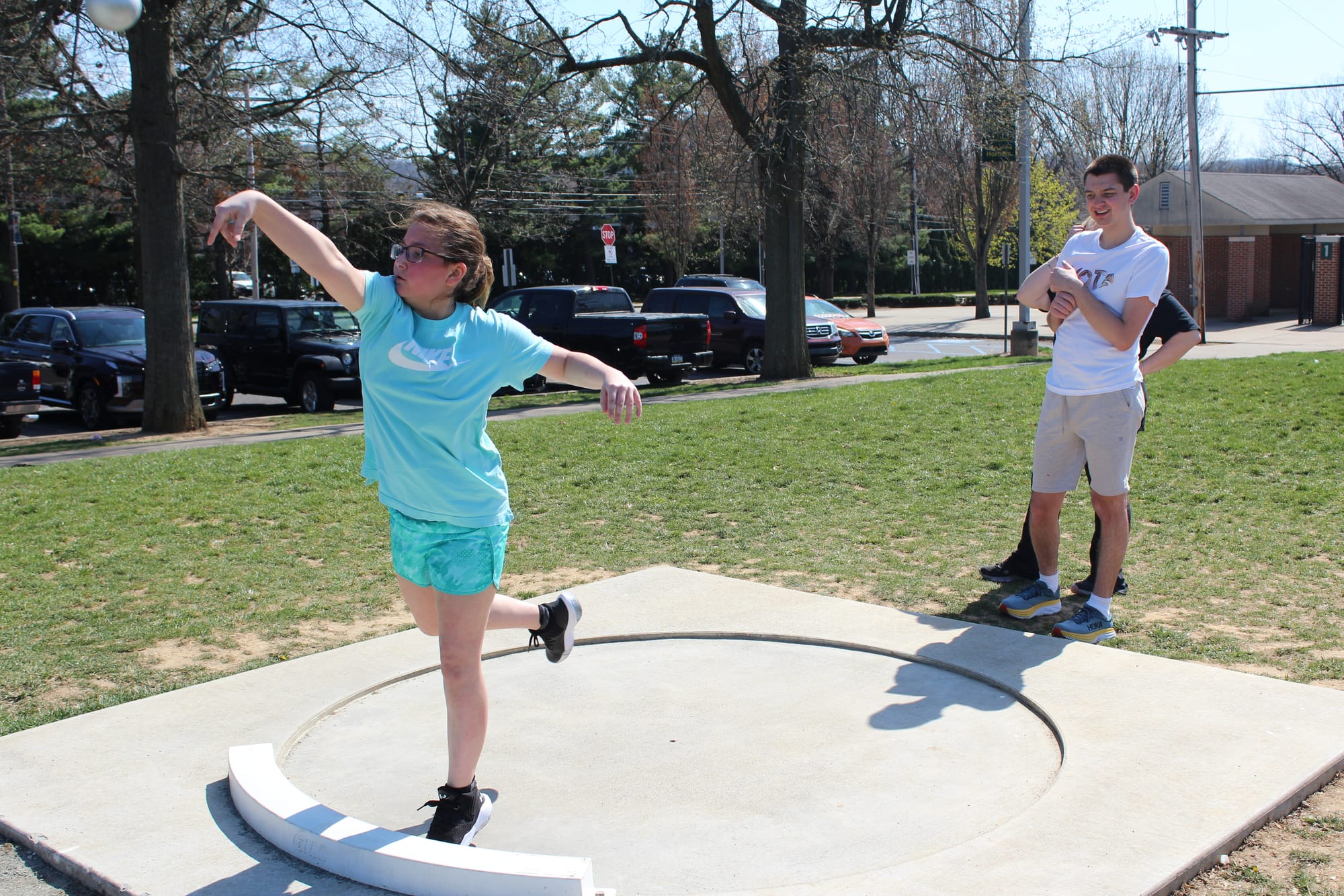 Jaclyn Chiego and Joshua Solderich practicing shot put Wednesday