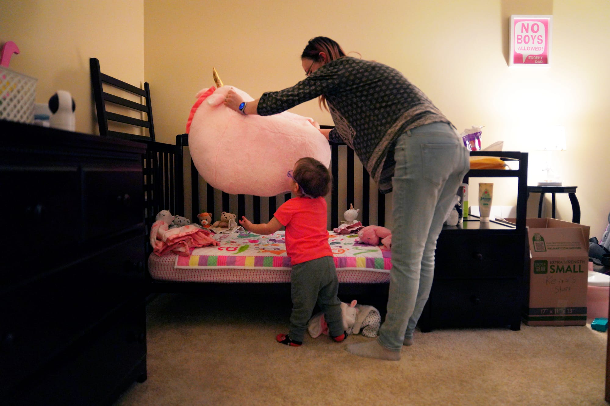 Lauren Hackney plays with her 1-year-old daughter during a supervised visit at their apartment in Oakdale, Pa., on Thursday, 