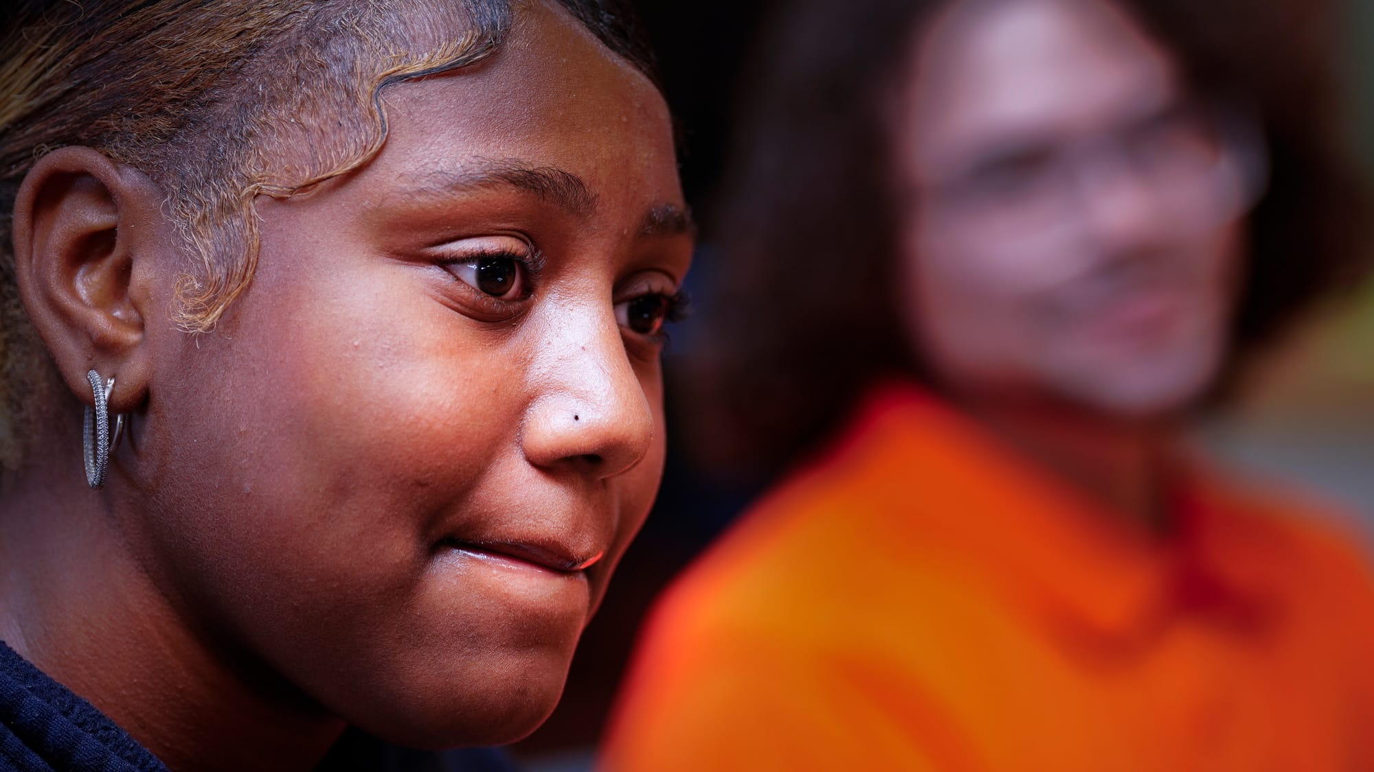 Seventh grader Chaileima Chomas, 13, listens during an in-school discussion with Violence Prevention Youth Mentor Damian Mele