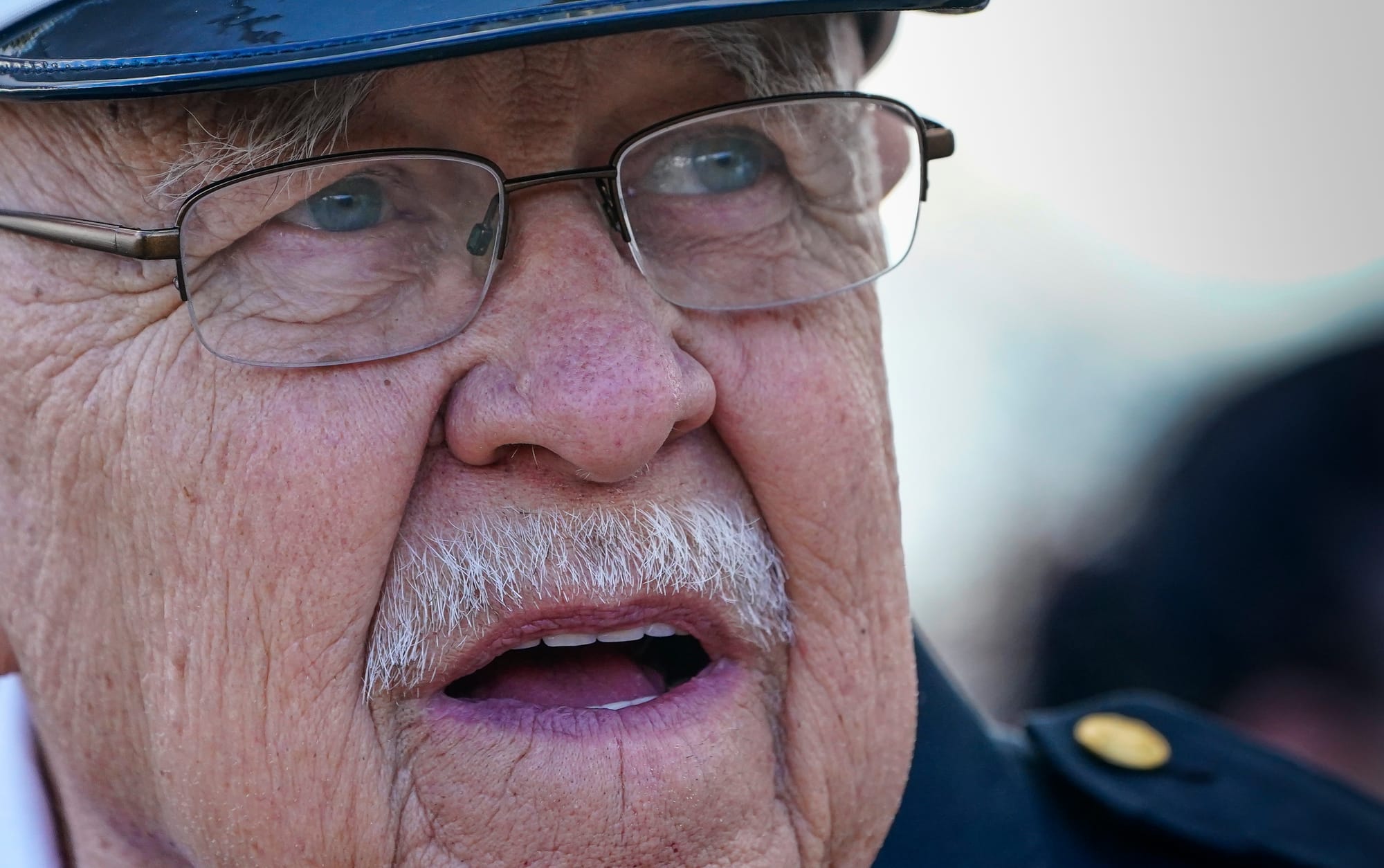 Don Norder, Fire Police Captain with Neffs Fire Company arrives Saturday. Mourners gather at Northwestern Lehigh Middle Schoo