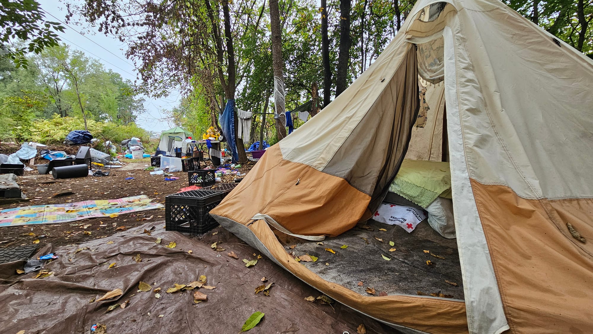 A portion of the homeless encampment along the Jordan Creek in Allentown remained untouched Tuesday, Sept. 30, a day after ci
