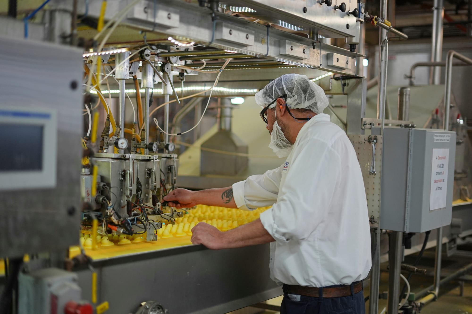 A worker monitors Peeps marshmallow treats as they move through the manufacturing process at the Just Born factory in Bethleh