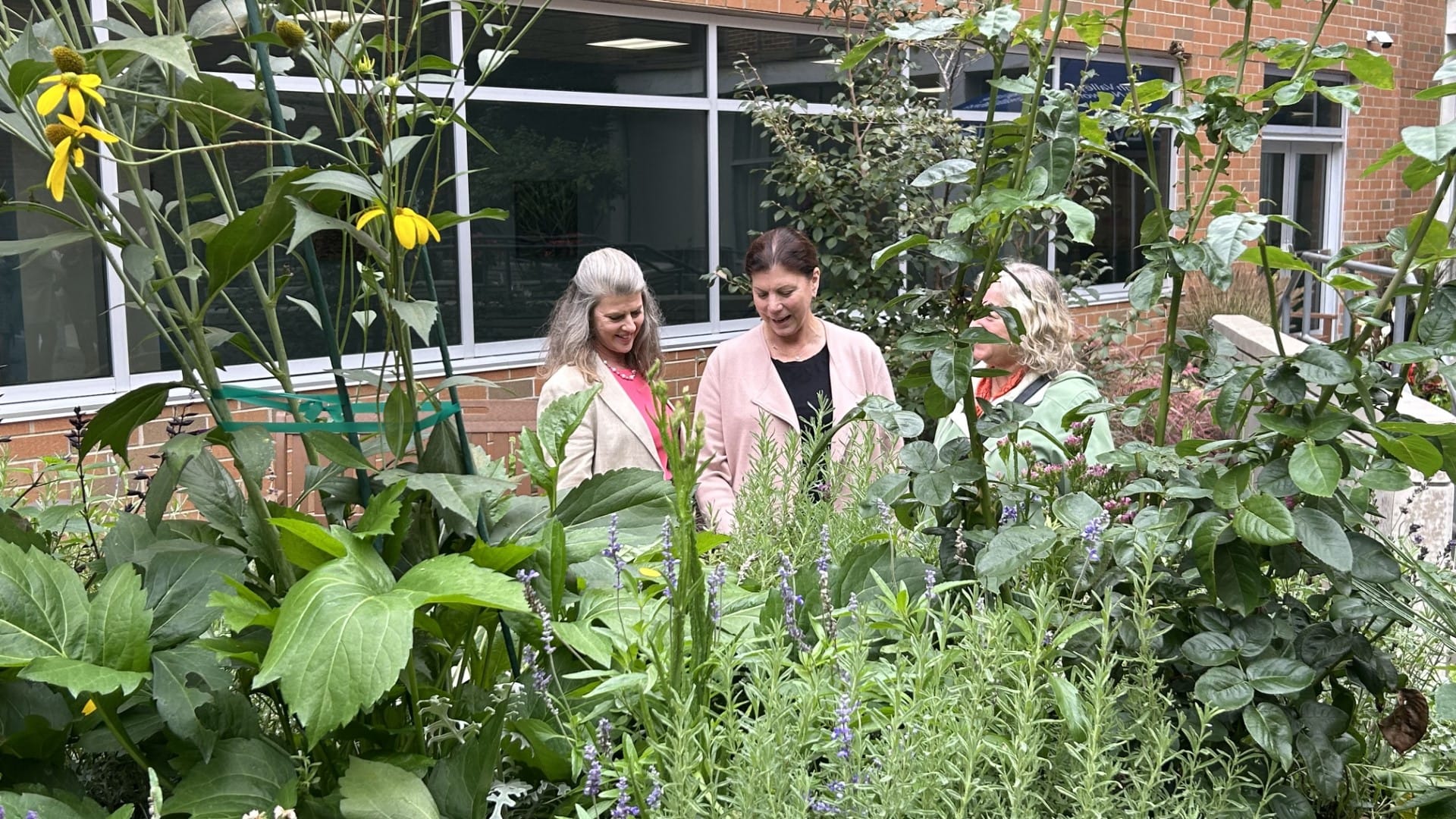 Master gardeners Kristen Lissy and Leesa Wimmer admire their work at LVHN's community healing garden at Lehigh Valley Hospita