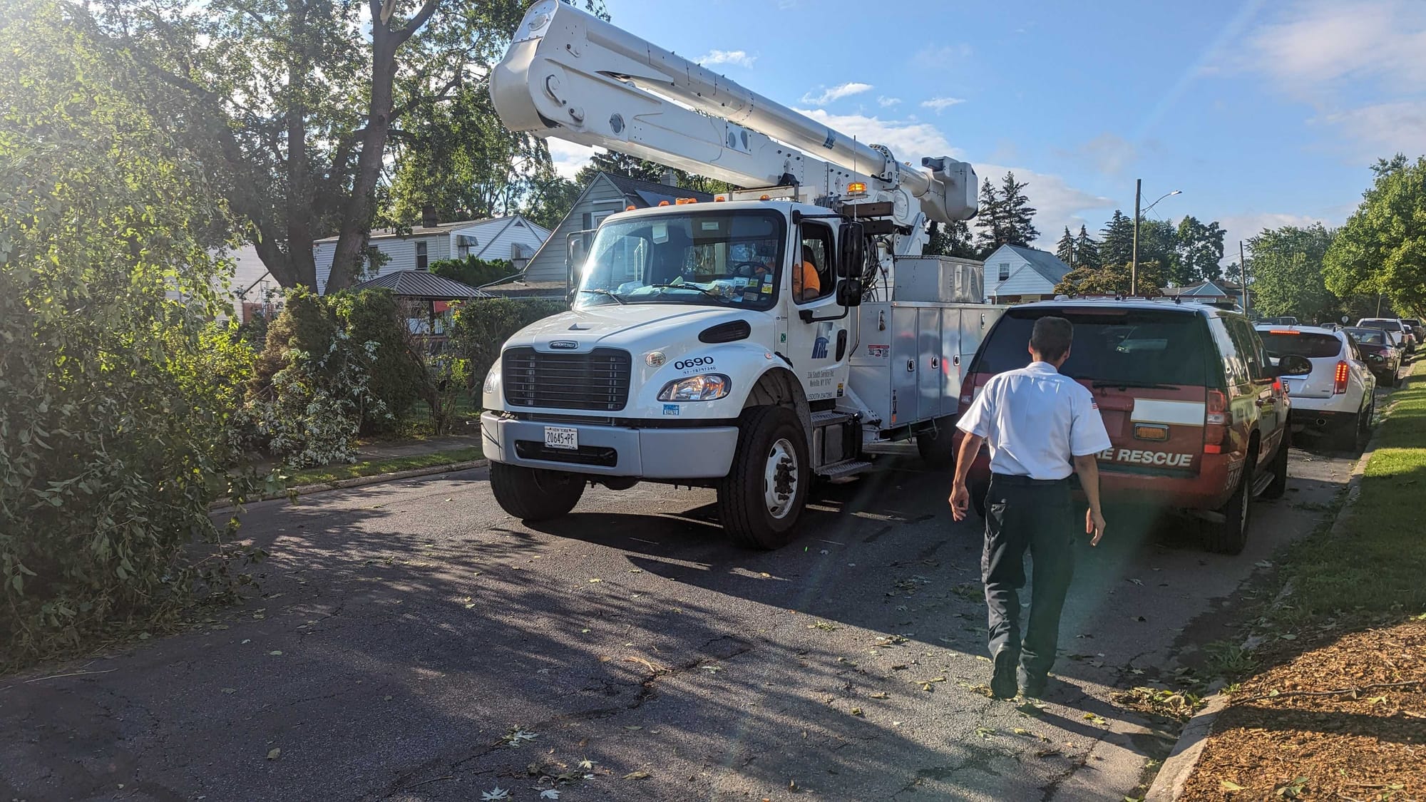 Power trucks arrive. Capt. Christopher from AFD is surveying damage.