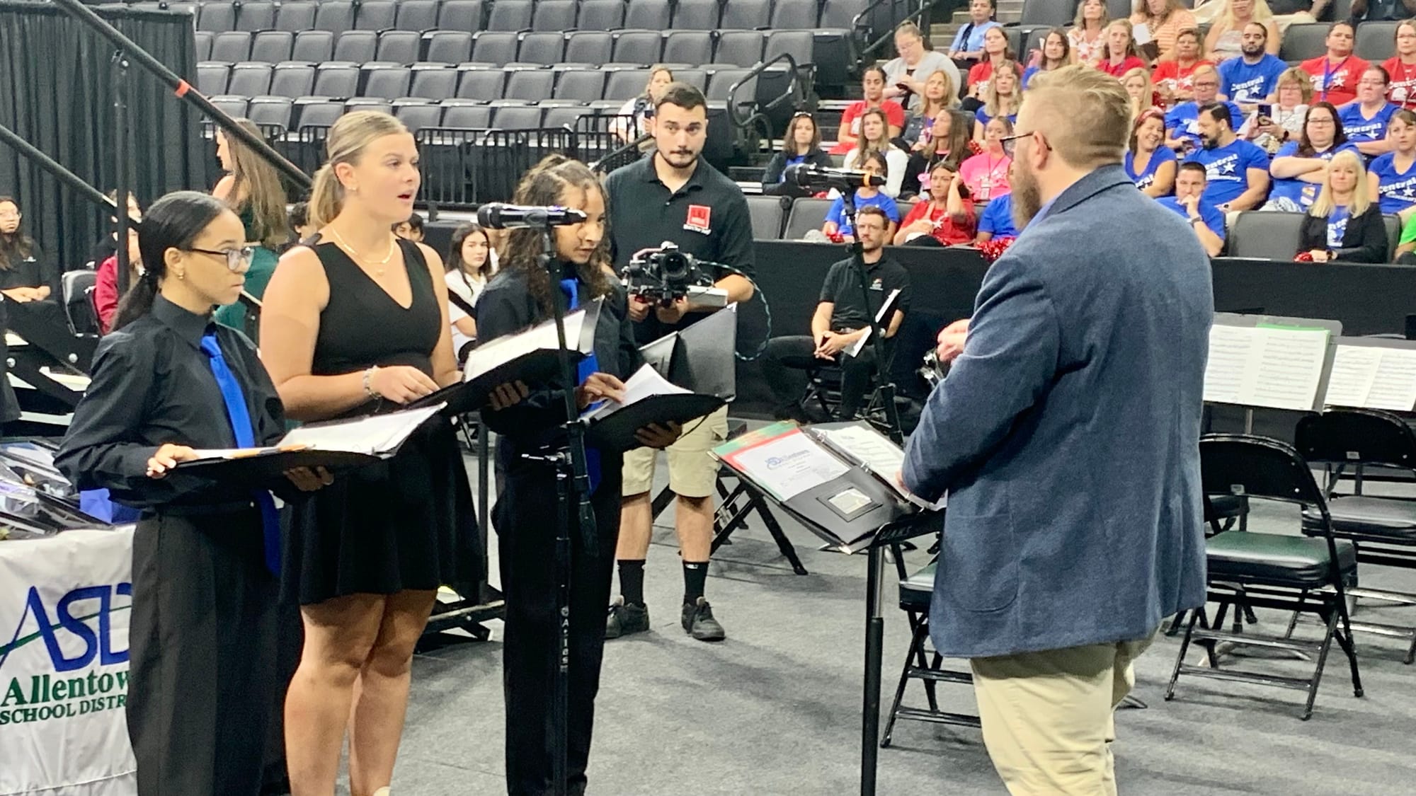 Chorale students Megan Edinger, Kiara Larrama and Keyliana Maga Gonzalez under the direction of Brandon Remp