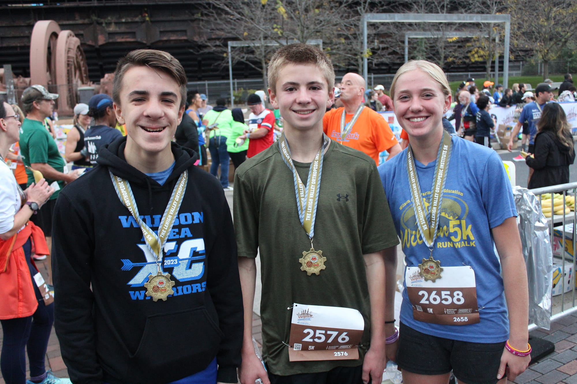 Students Justin Hetrick, Owen Smith and Julie Bonham came of Wilson School District Cross Country after the 5k race.