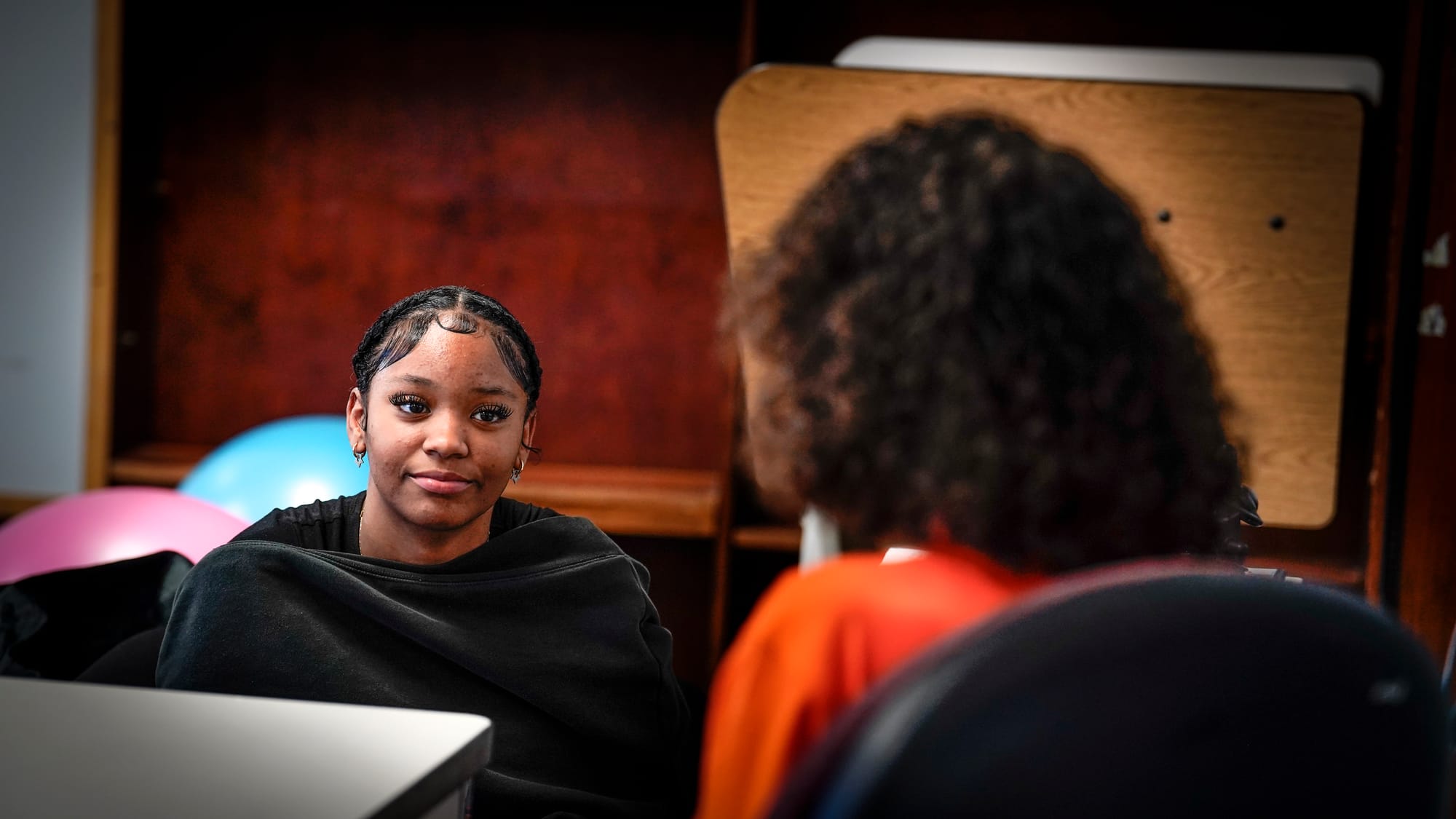 Eighth grader Pamela Concepcion, 14, listens during an in-school discussion with Violence Prevention Youth Mentor Damian Mele
