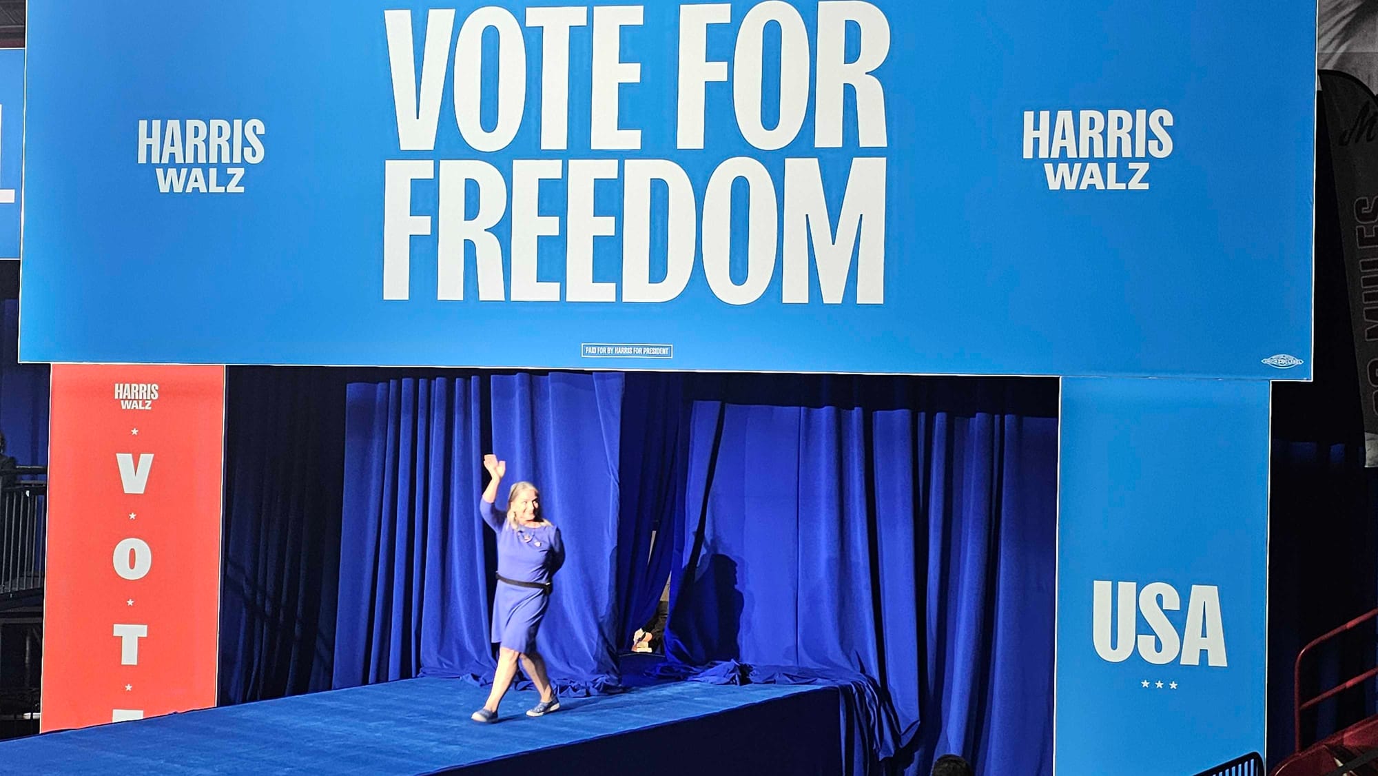 U.S. Rep. Susan Wild enters the stage at Muhlenberg College ahead of Vice President Kamala Harris' visit.