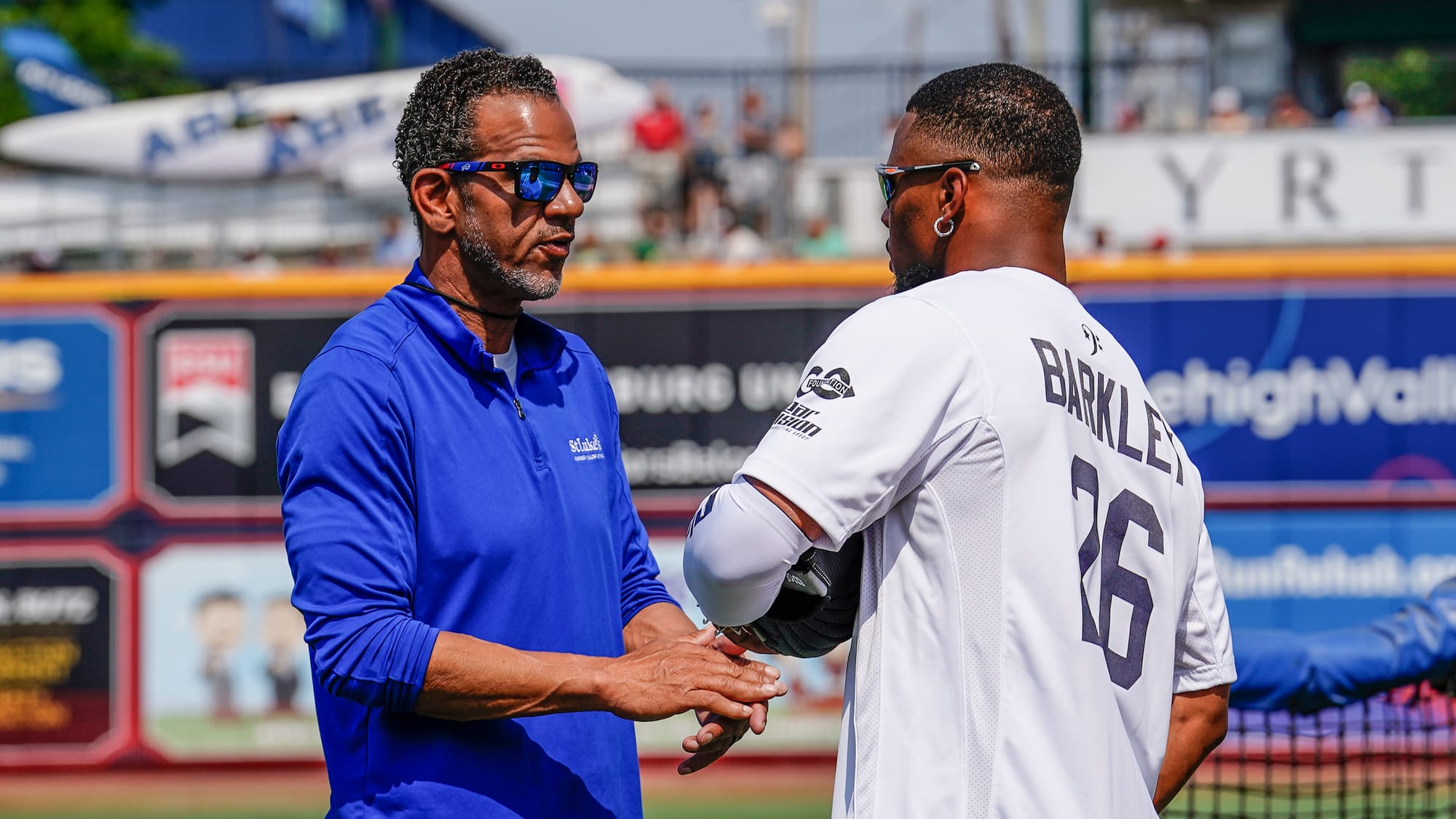 former Buffalo Bill player andre Reed, left, greets Saquon Barkley of the New York Giants. The 2nd annual Devonta Smith Celeb