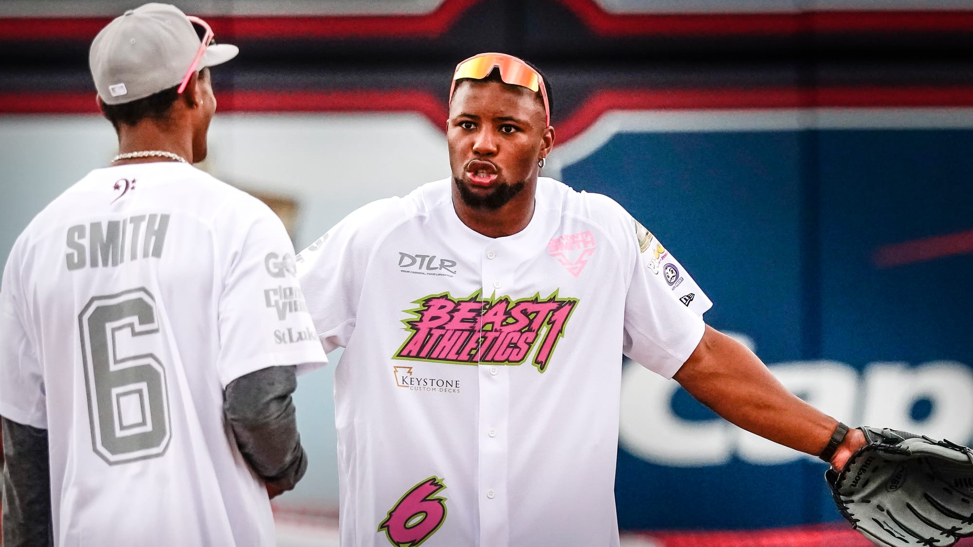 Saquon Barkley asks DeVonta Smith about a call. The annual Devonta Smith Celebrity Softball Game featuring Philadelphia Eagle