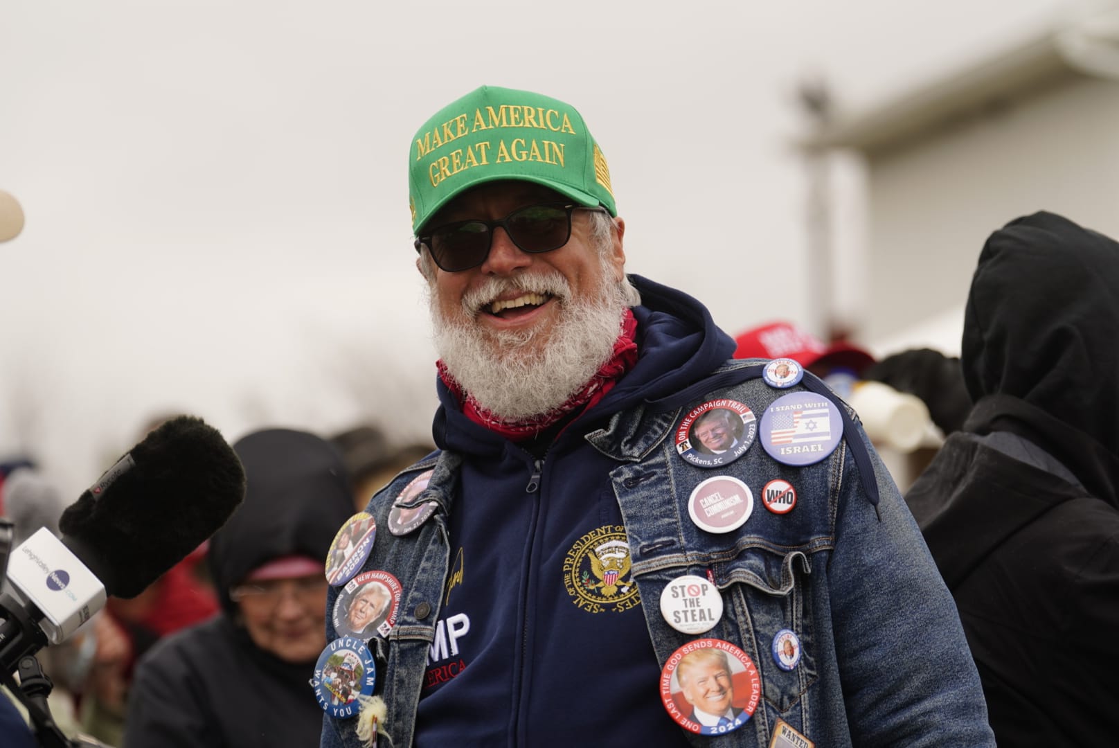 People gather ahead of Donald Trump's rally in Schnecksville, Pa. on Saturday, April 13, 2024.