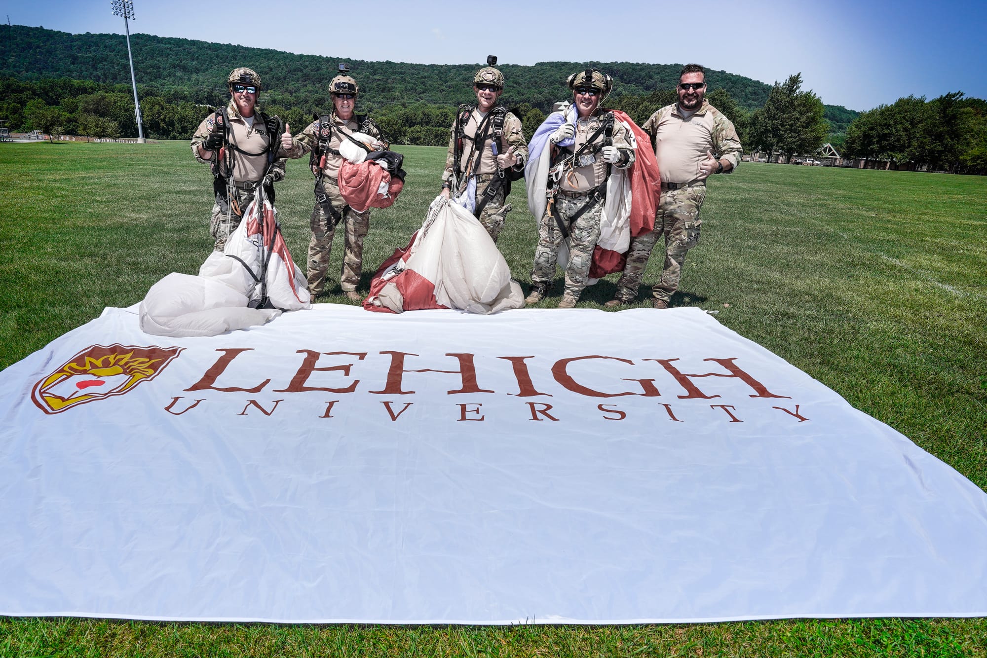 U.S. Special Forces members including U.S. Navy SEALs skydive from 4,000' onto the field near Goodman Stadium at Lehigh Unive