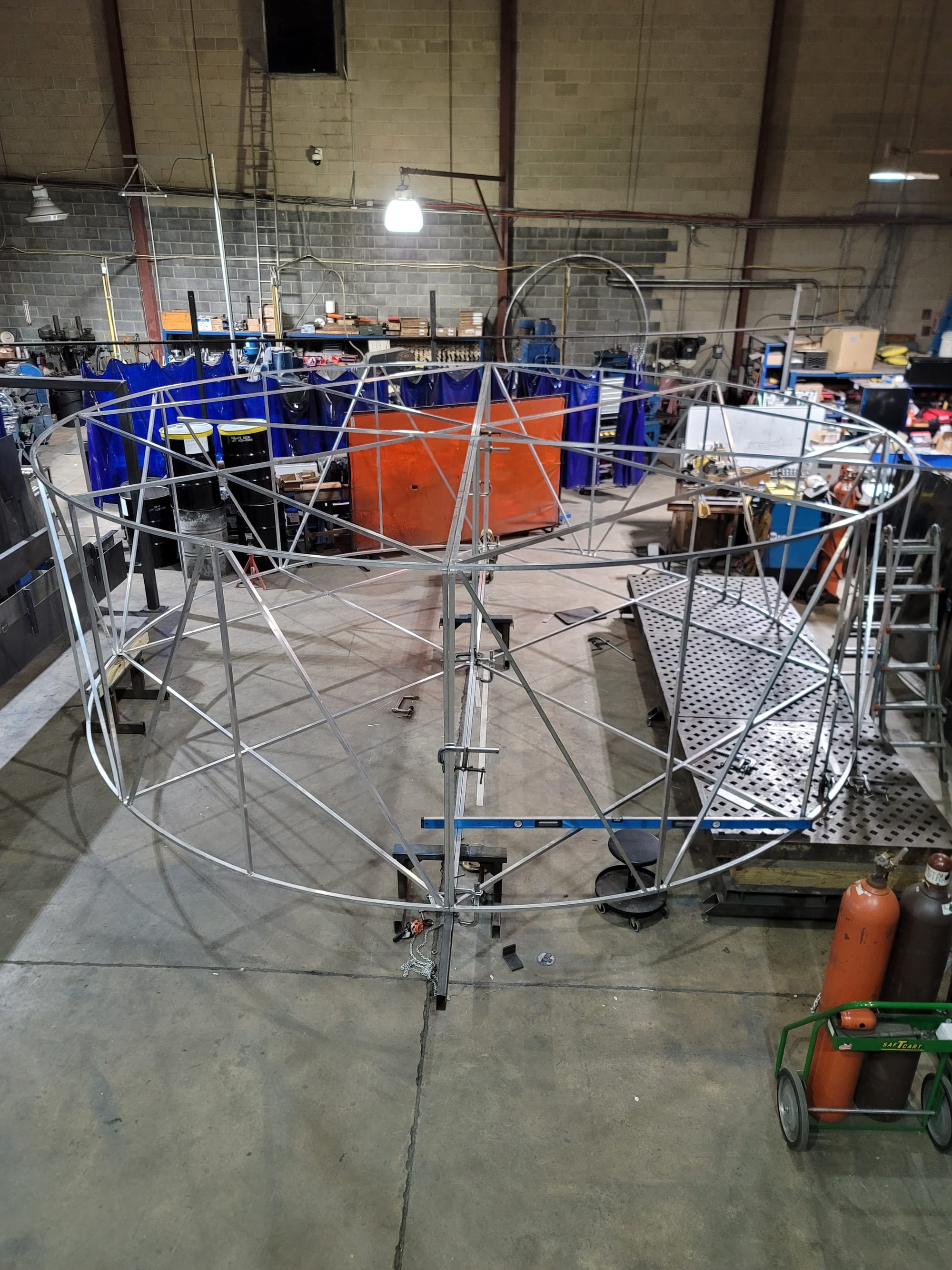 Workers at Richmond Machine & Welding work on building an enormous hockey puck at the shop in Hanover Township, Northampton C