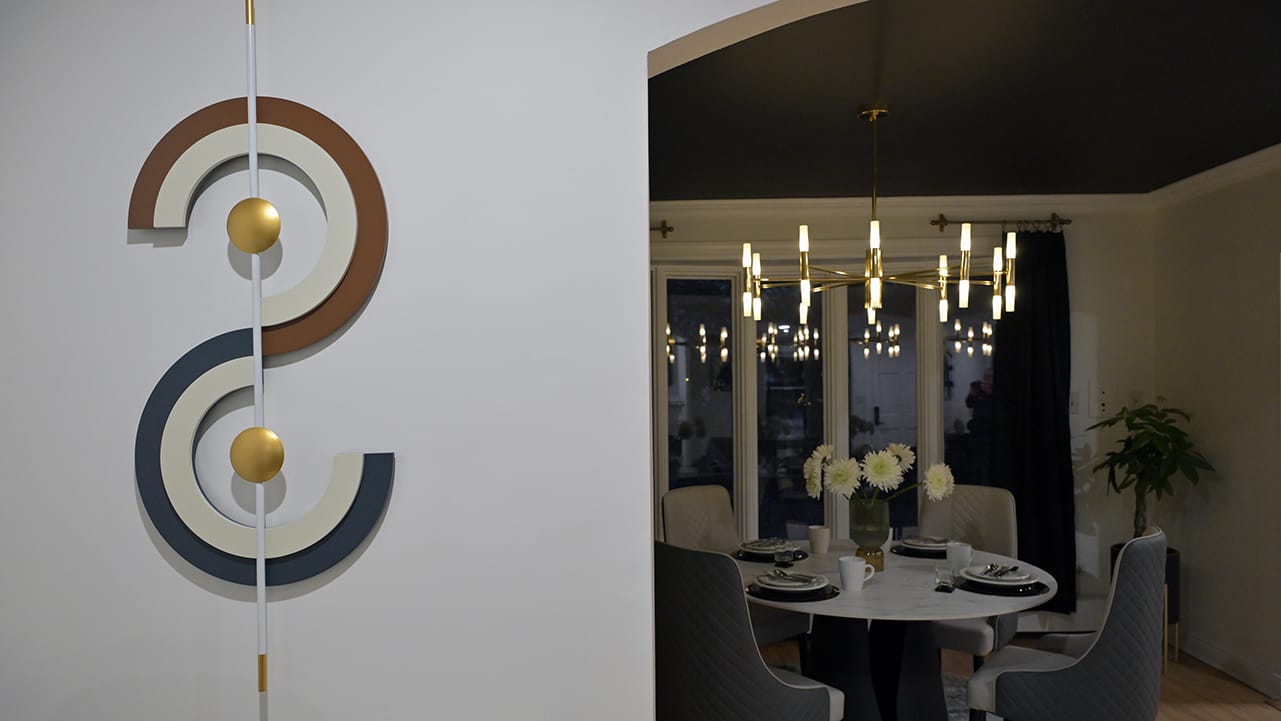 Artwork is a focal point on the wall of a West Bethlehem home recently designed by Wandra Cain. The dining room is visible to