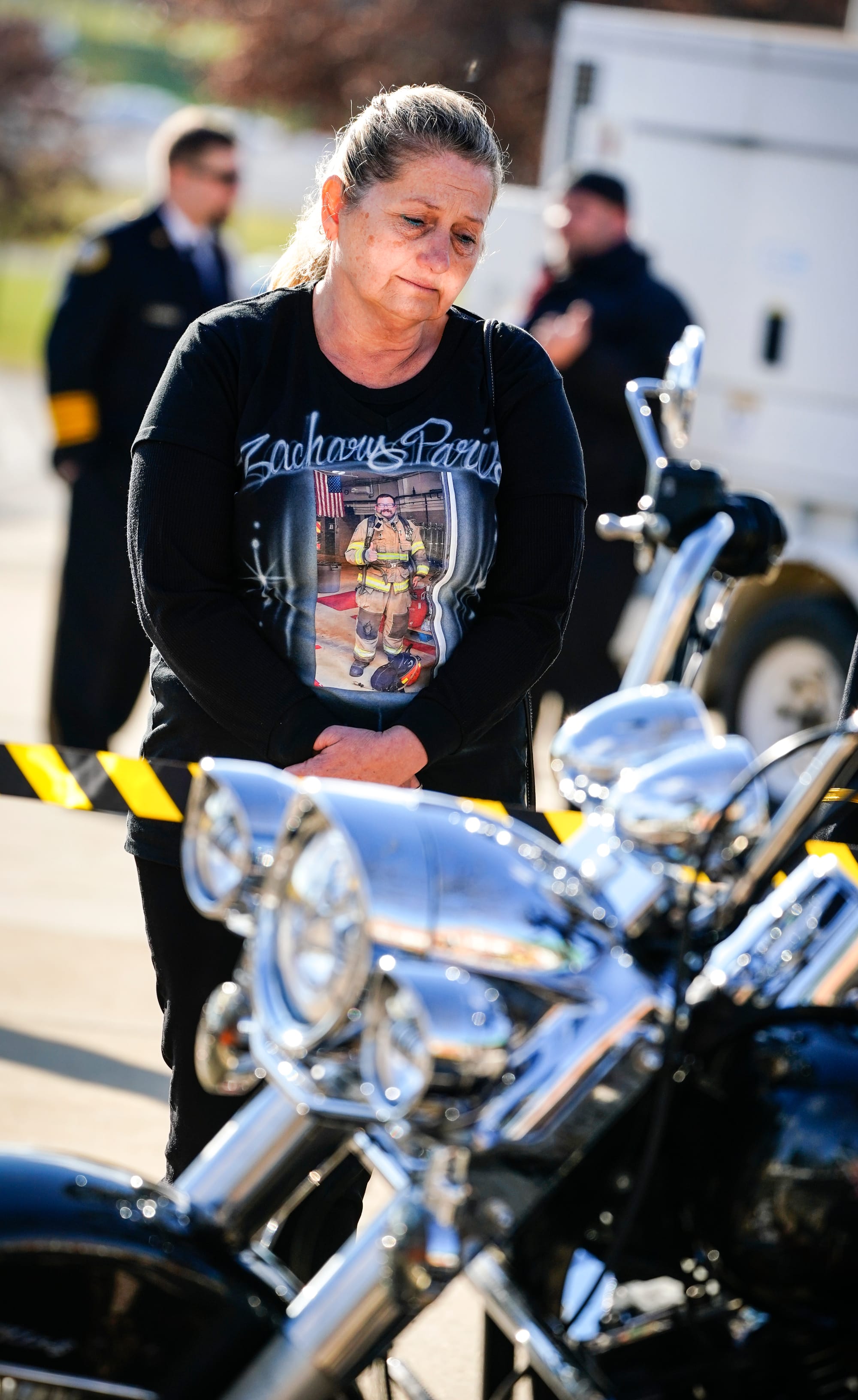 Carol Paris, mother of fallen New Tripoli firefighter Zachary Paris, looks at a display of her late son's things including hi