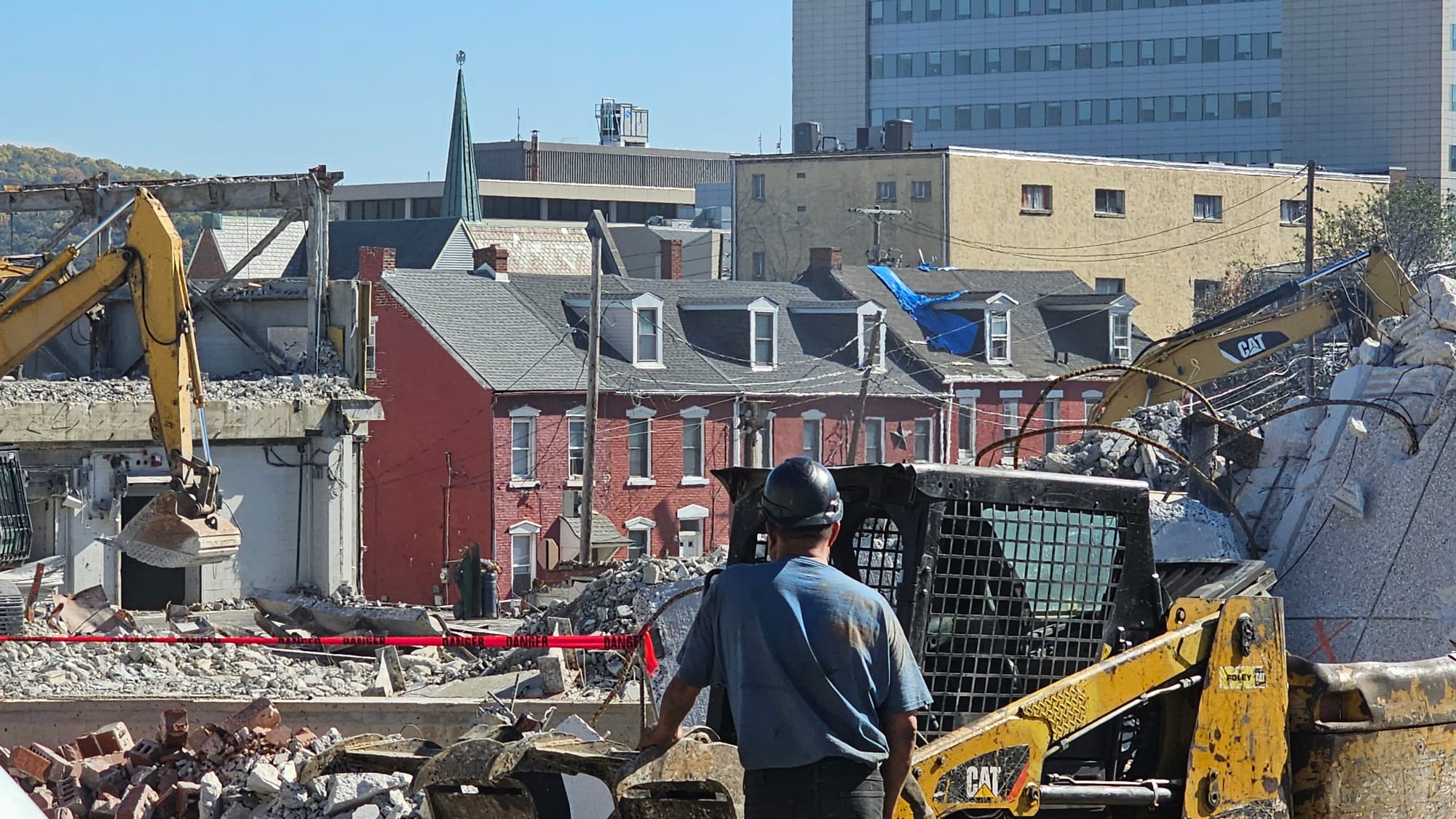 A worker looks out over the demolition site at the former Morning Call building Tuesday, Oct. 24.