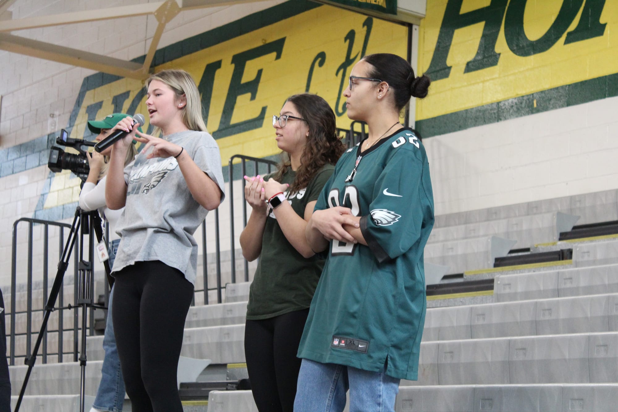 Emmaus High School students leading their peers in cheering for the Eagles' Kyzir White