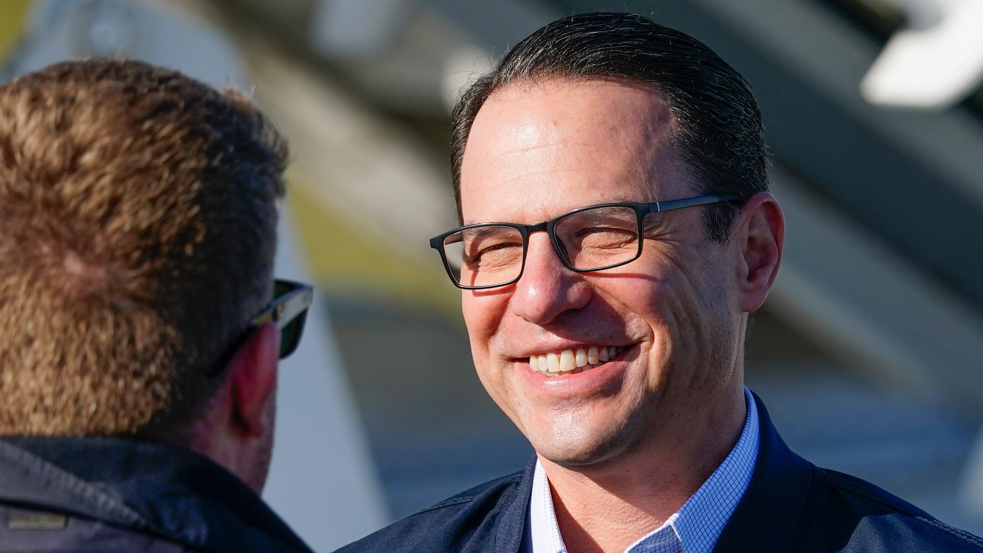 Pa. Gov. Josh Shapiro awaits President Biden. President Joseph Biden lands at Lehigh Valley International Airport on Friday, 