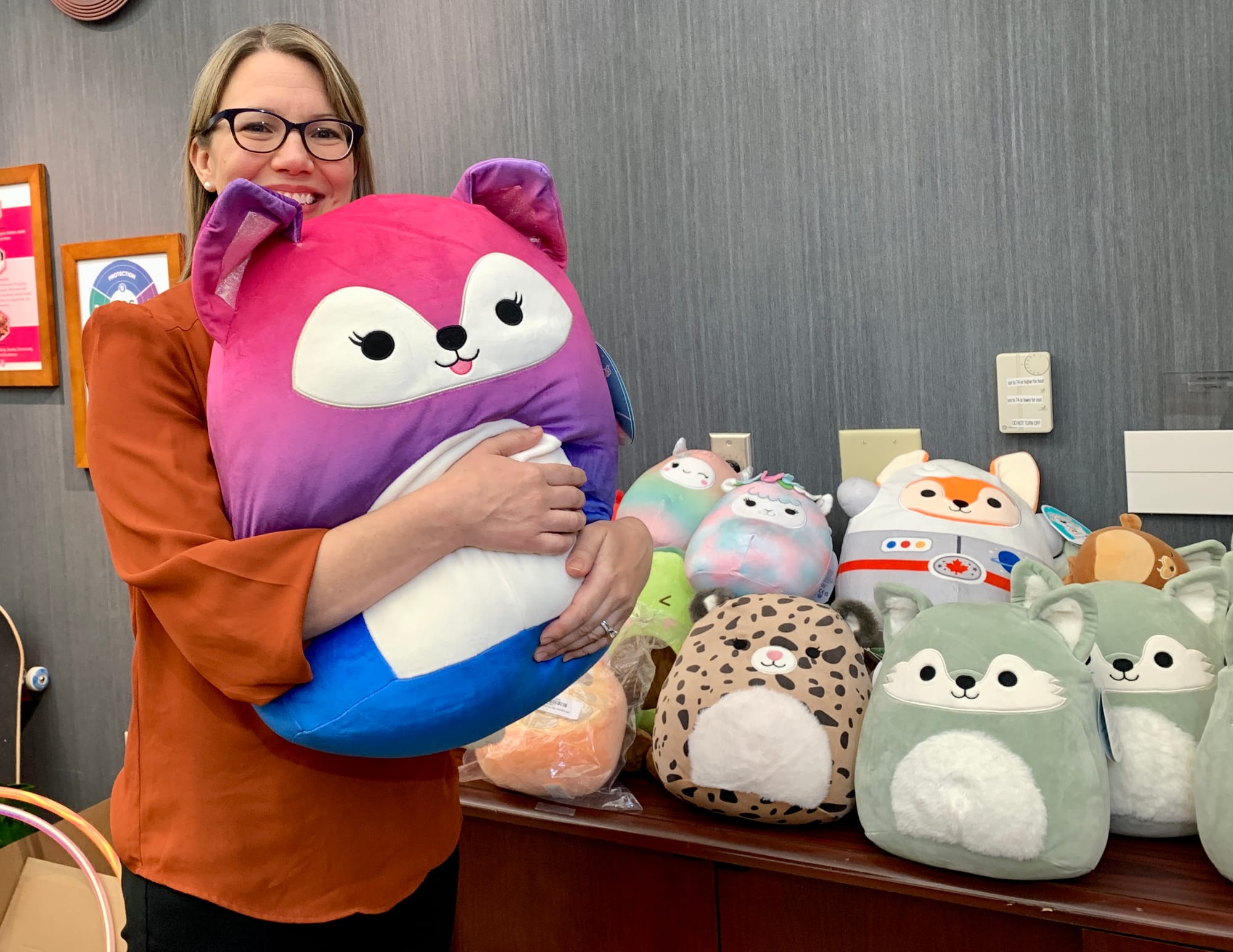 KidsPeace Director of Development Missy Hartney holds a squishmallow.