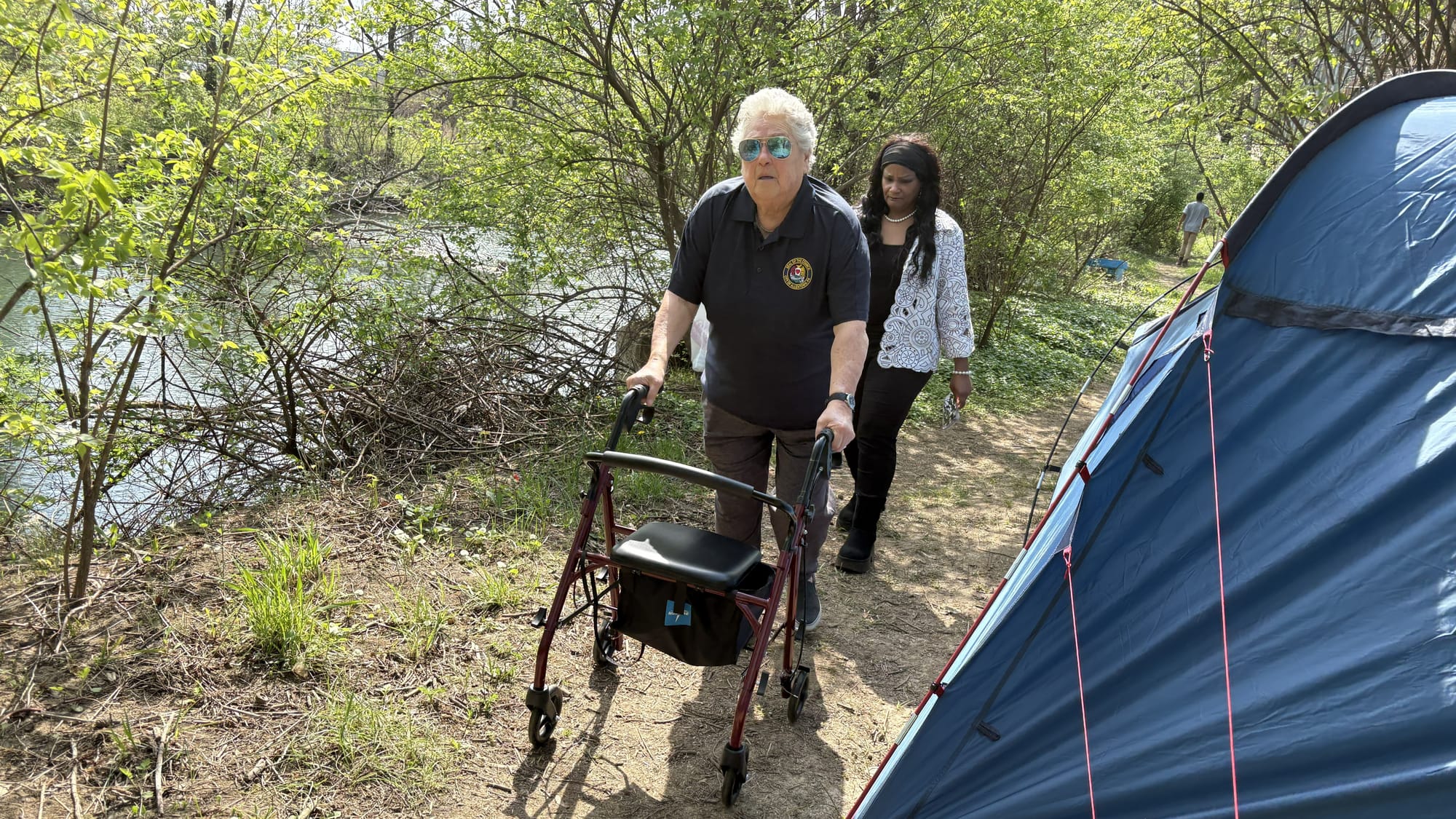 Allentown City Councilwomen Candida Affa and Cynthia Mota walk through a homeless camp along the Little Lehigh Creek on Wedne