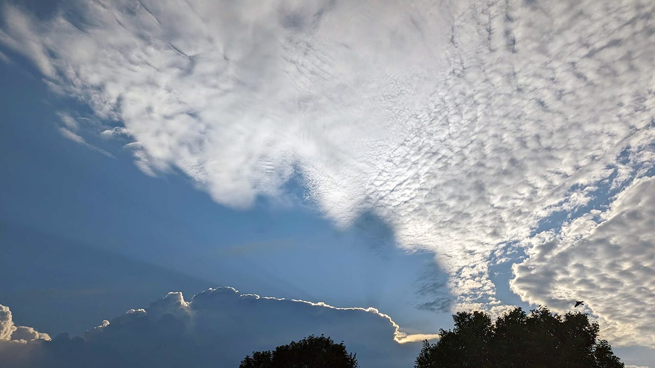 Sunrise through clouds building over Allentown on Friday, July 14, 2023.