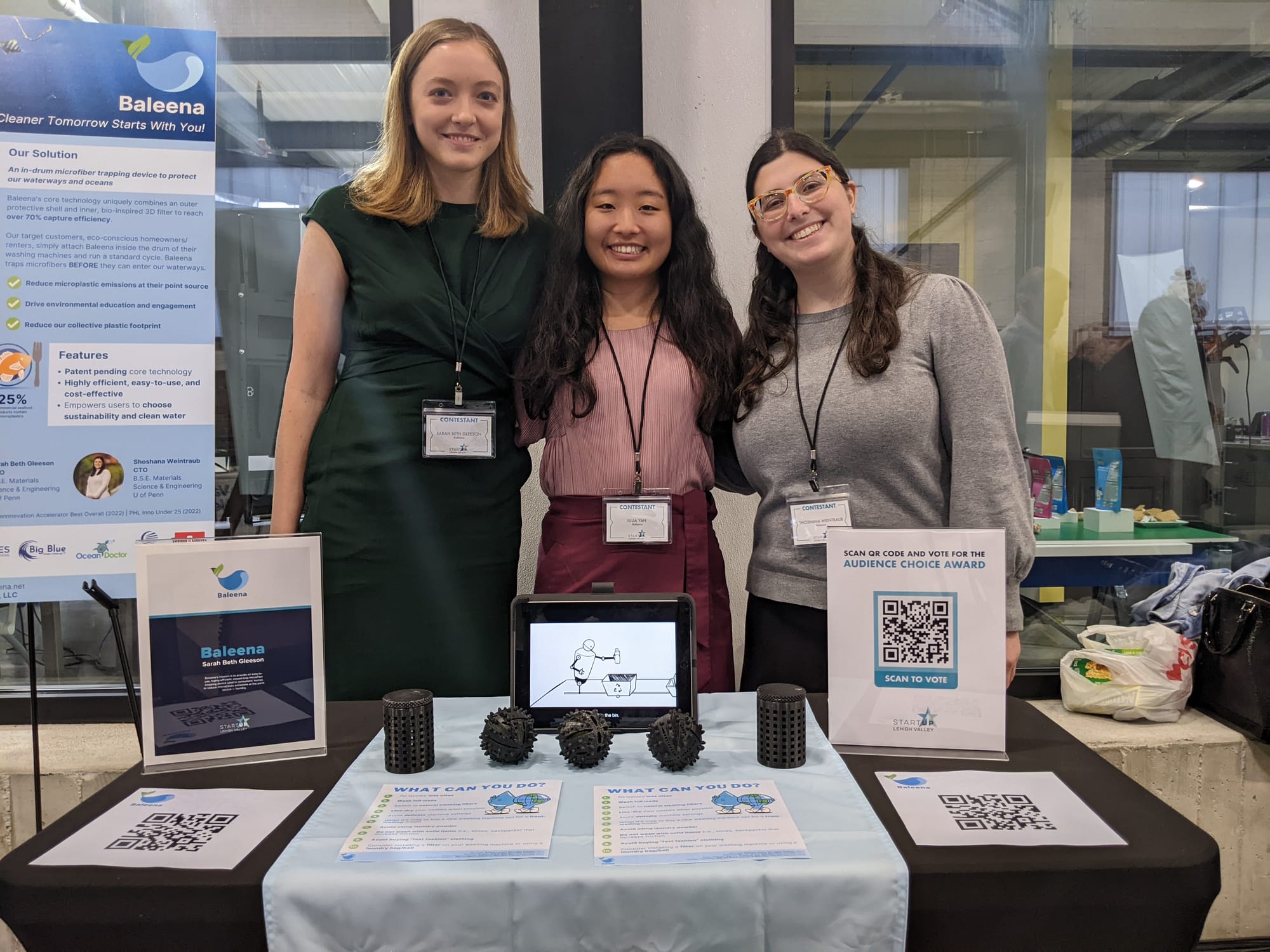 Contestants are at their booths talking about the products they have created. First photo: Absurd Snacks founded by Grace Mit