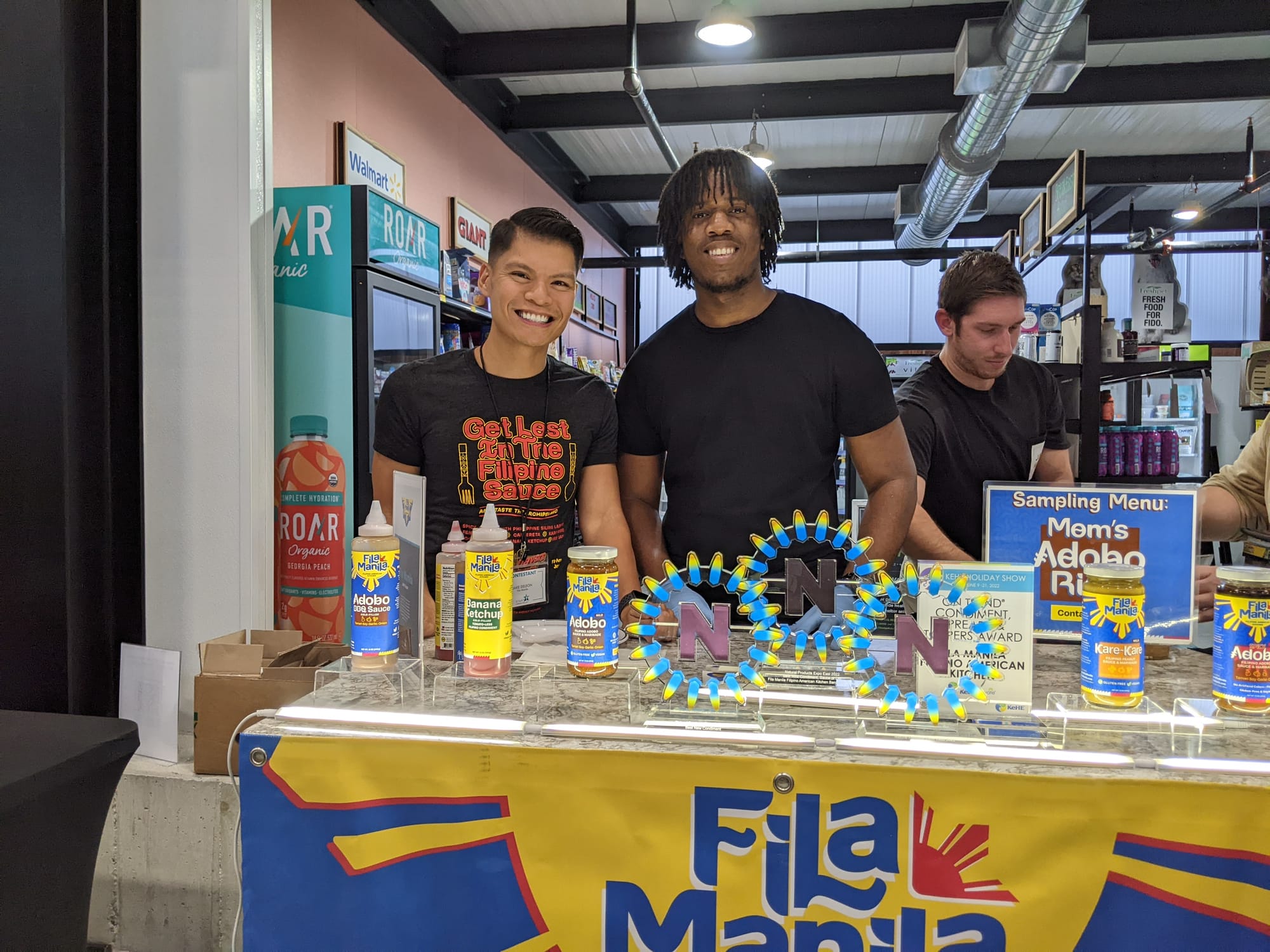 Contestants are at their booths talking about the products they have created. First photo: Absurd Snacks founded by Grace Mit