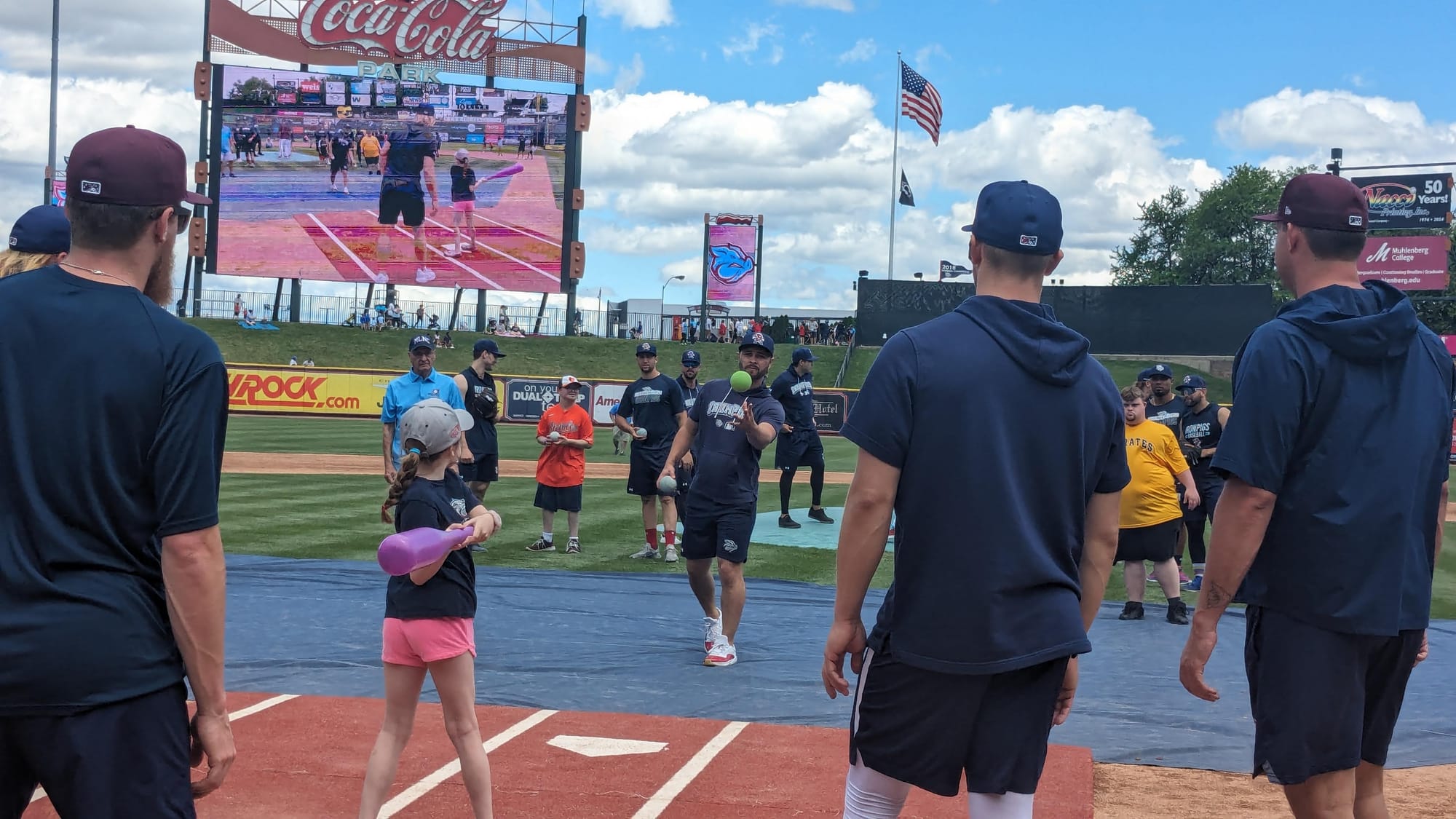 A hitter at bat with help from members of the Lehigh Valley IronPigs during an exhibition game between Miracle League of Nort