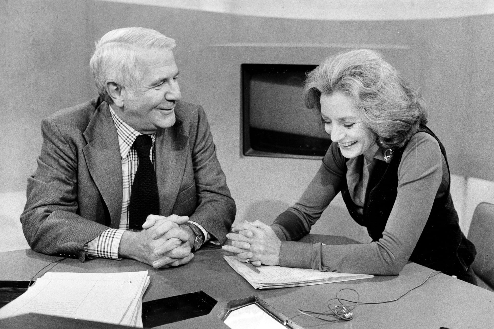 Co-anchors Barbara Walters and Harry Reasoner, of ABC News, on the set of the evening news program after Walters debuted as t
