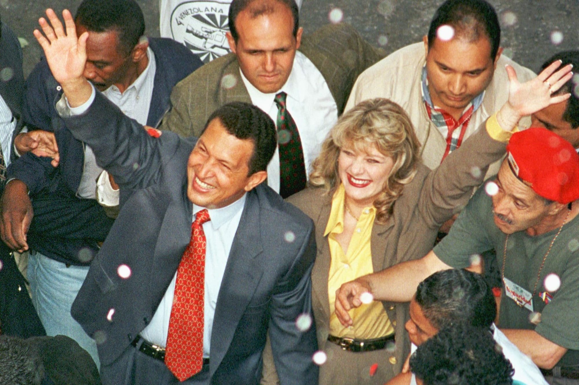 Chavez and his wife, Marisabel, wave to supporters in July 1998, as Chavez arrives at the National Electoral Council to regis