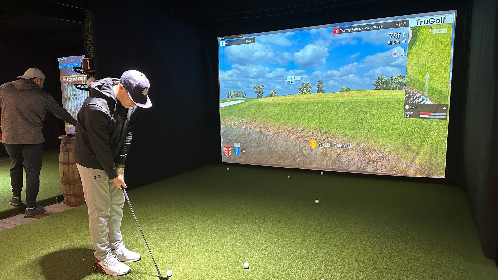A guest at Twisted Tees plays a round of TruGolf.