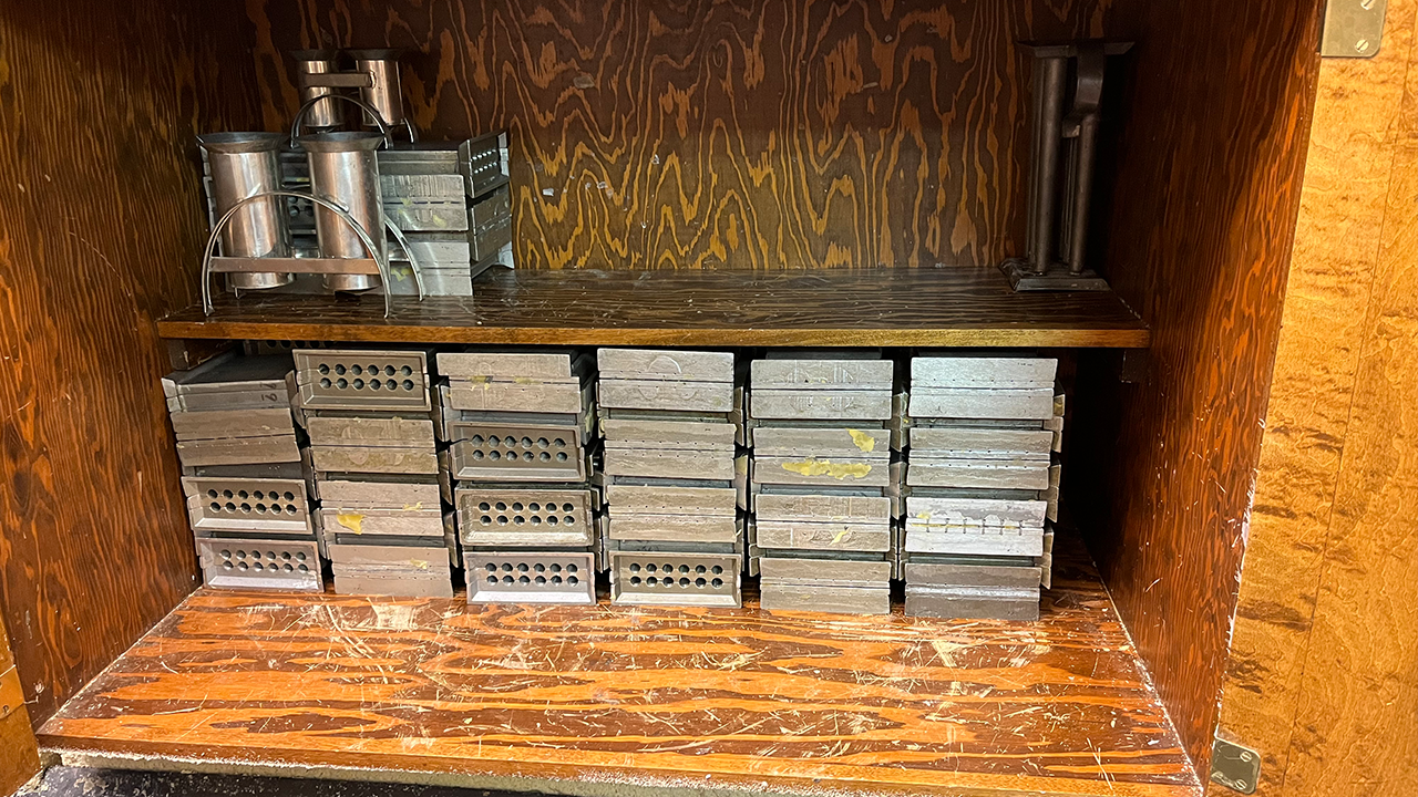 Aluminum molds for 6-inch candles are stored until volunteers start in on the 2024 supply next September.
