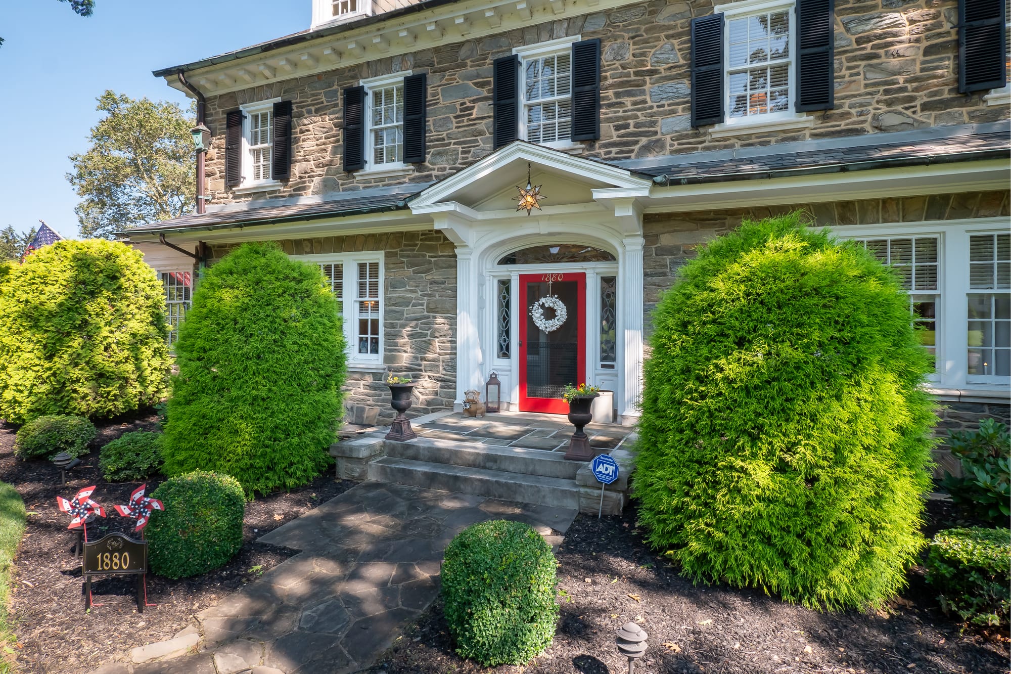 The 3-story Federal-Style Georgian Colonial mansion at 1880 W Union Boulevard sits on 1.27 acres and boasts a grand staircase