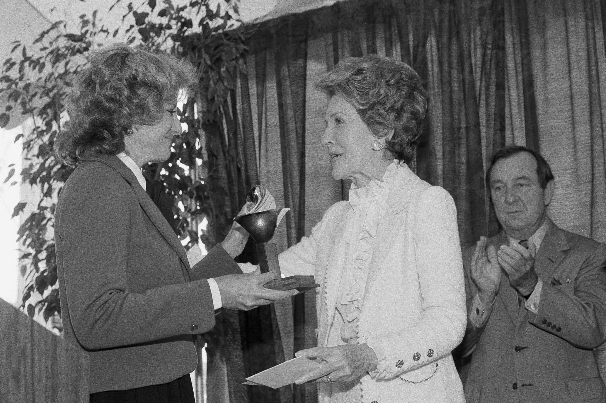 Walters, left, presents first lady Nancy Reagan the Woman of the Year Award from the United Services Organization, Sept. 29, 