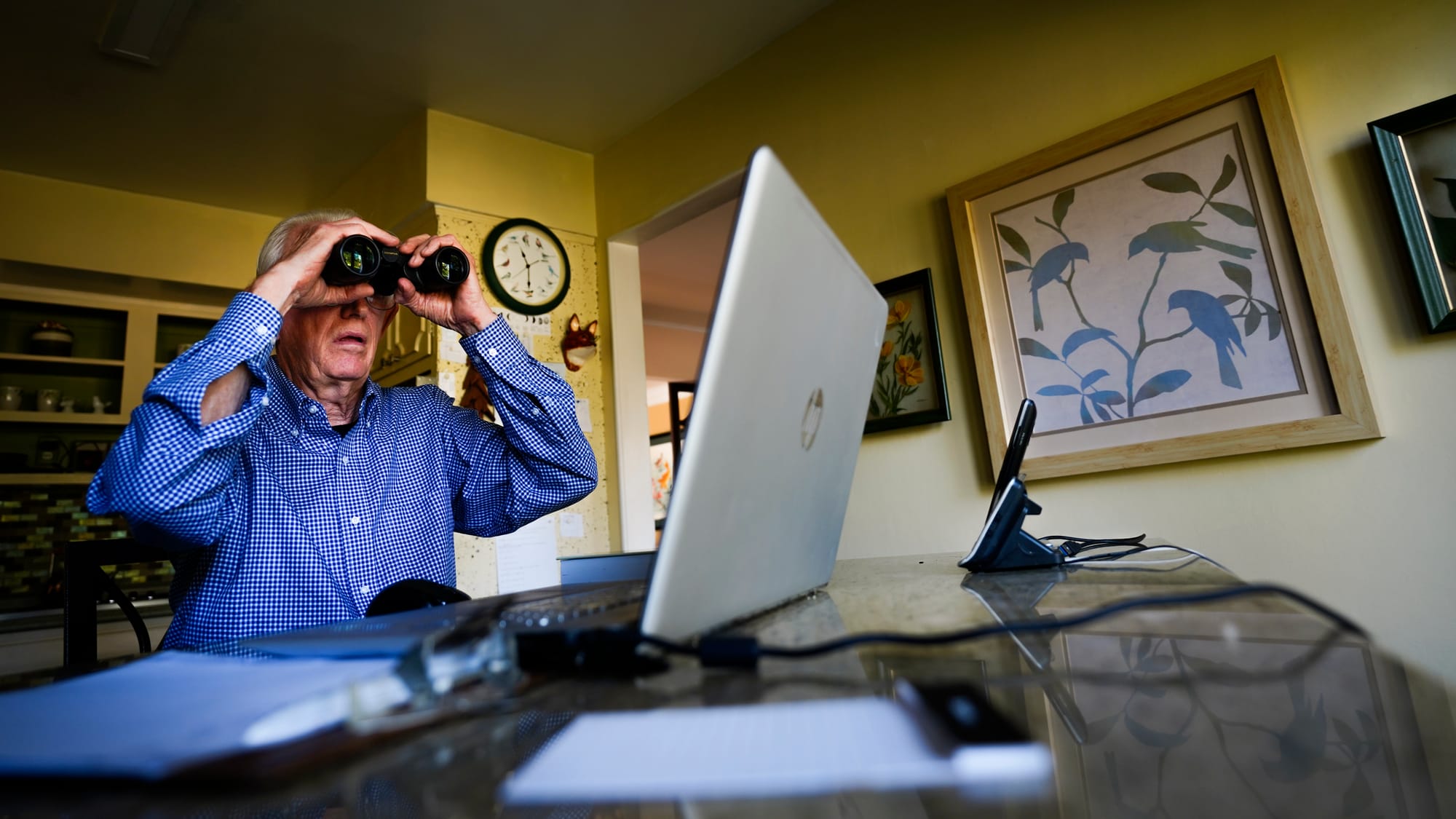 Fred Buse sits at his kitchen table and observes wildlife in his backyard. Fred Buse, 87, of South Whitehall Township, has be