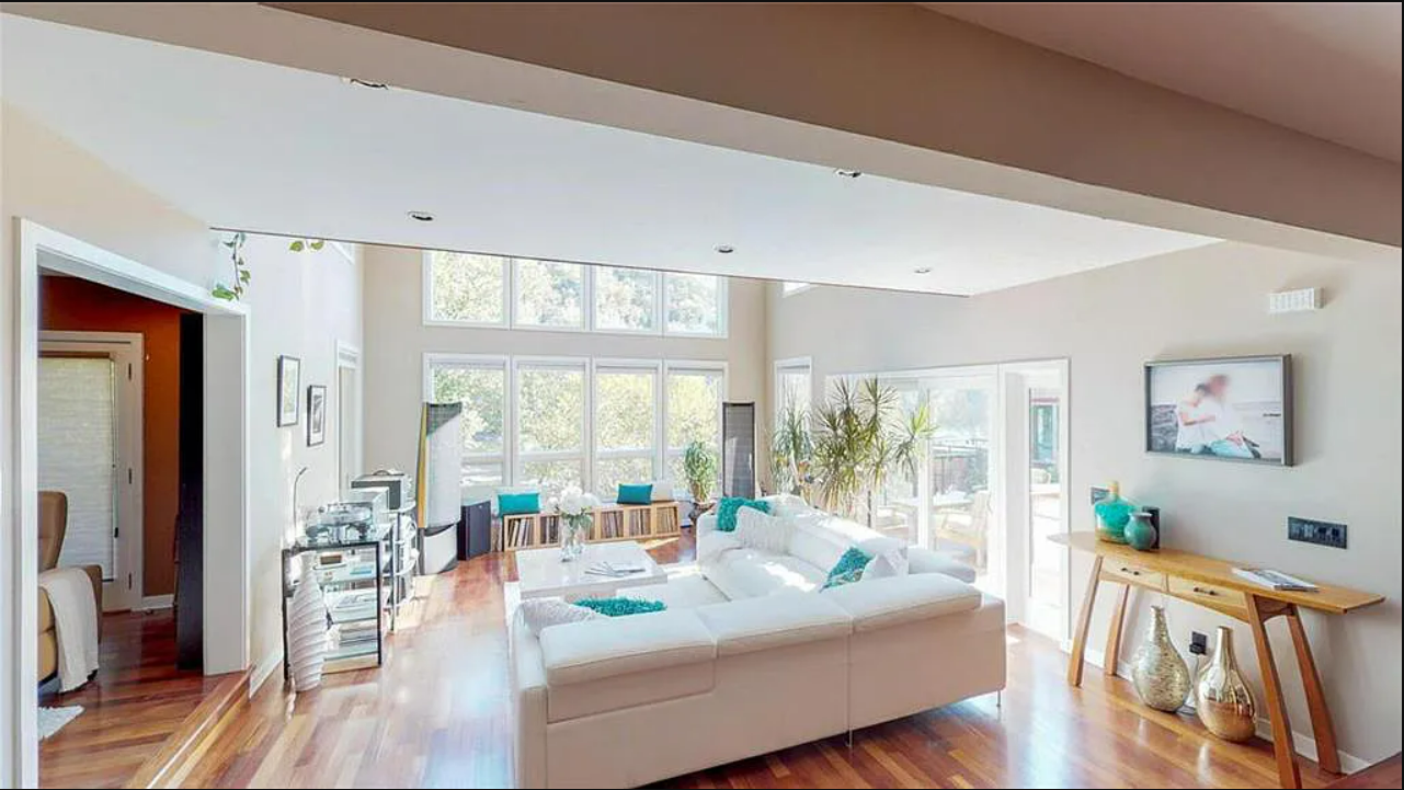 This family room flows into the kitchen