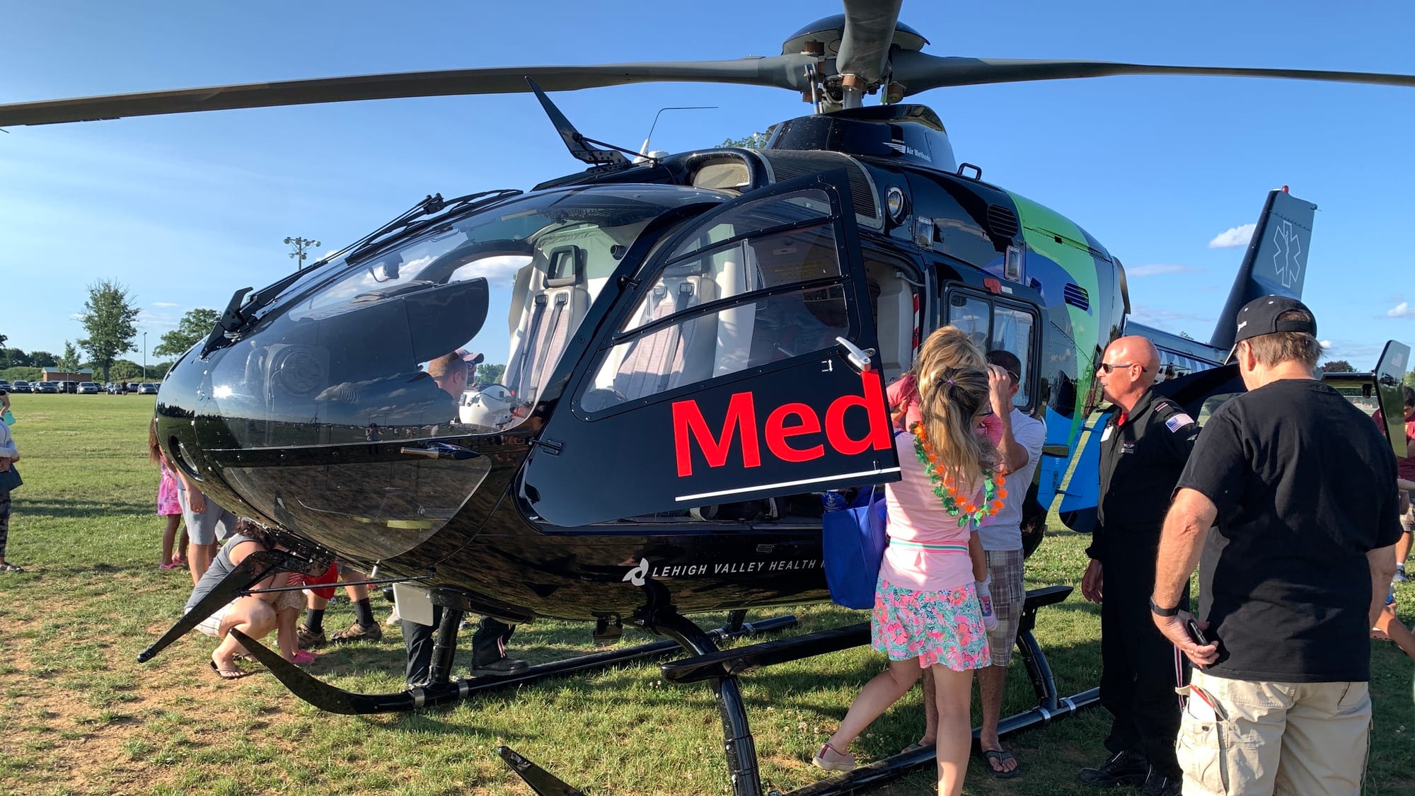 Kids get into the LVHN Medevac helicopter at Upper Macungie's National Night Out event.