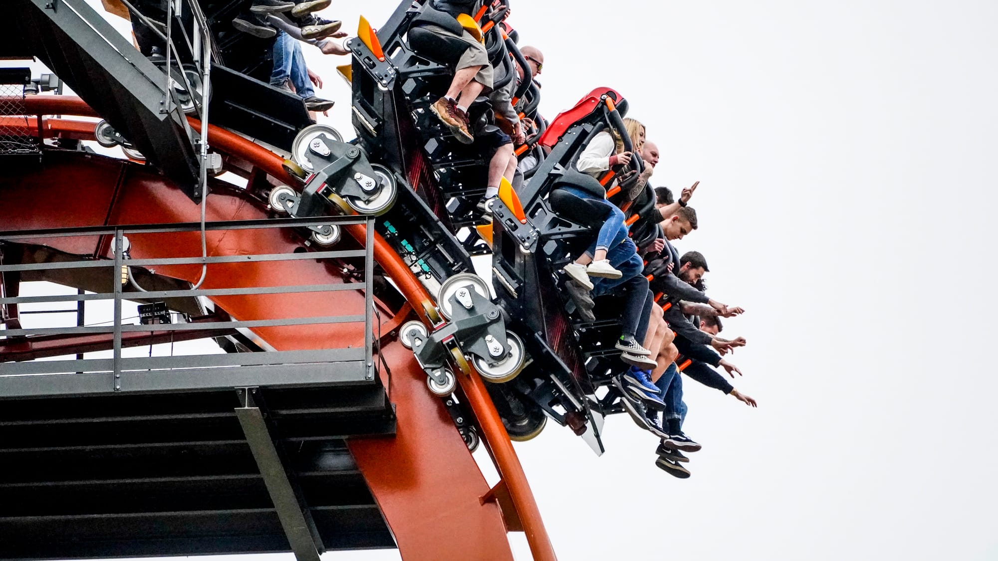 Hands in the air as riders on the new coaster Iron Menace prepare to drop.