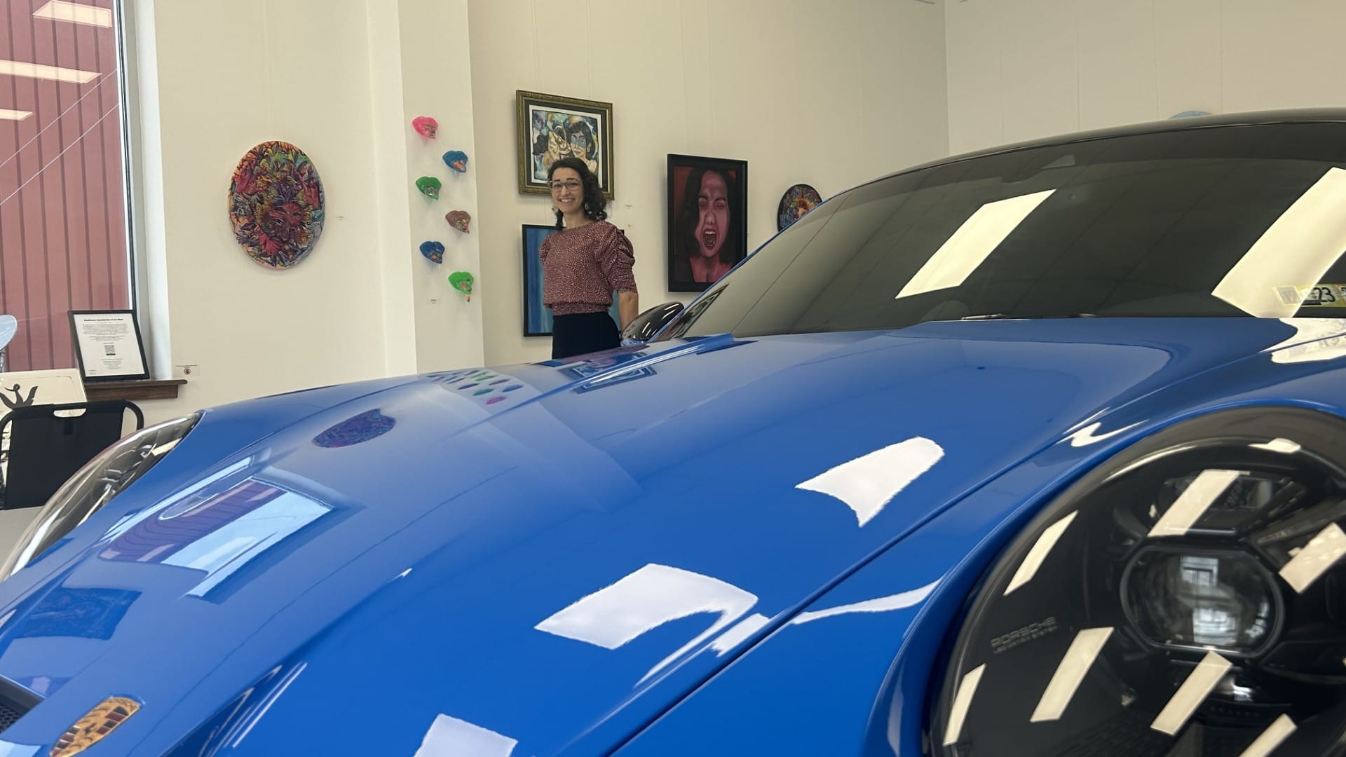 Nina Boodhansingh shows off Midnight Gallery is in the showroom of Vollux Autowerks, a car repair and diagnostics shop in Sch