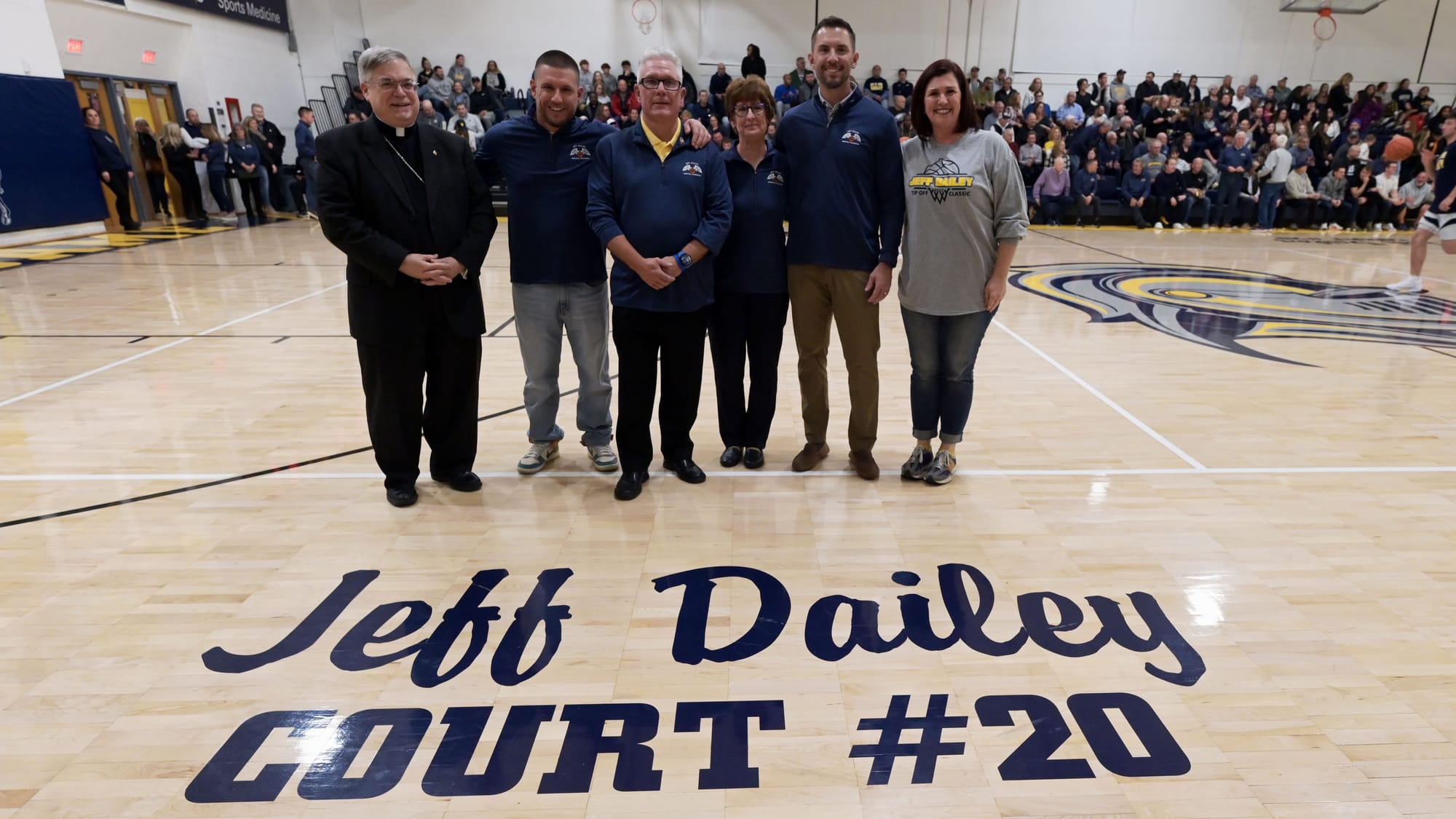 Family and friends gather during a court dedication for Jeff Dailey on Friday, December 1, 2023, at Notre Dame-Green Pond Hig