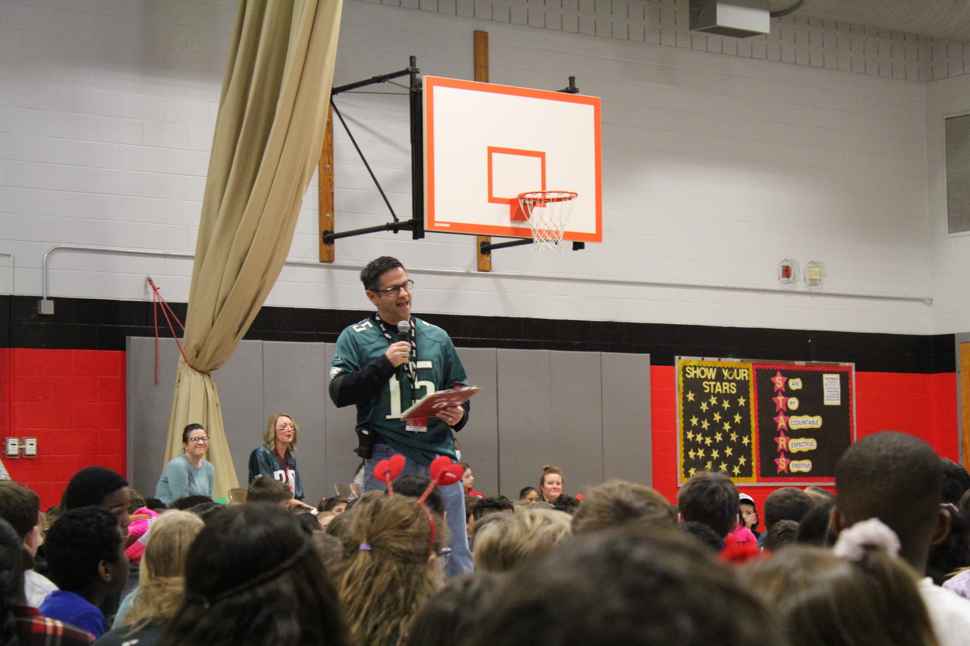 Cetronia Elementary School Principal Dr. Jamie Giaquinto speaking to the crowd of students in the gymnasium about the signifi