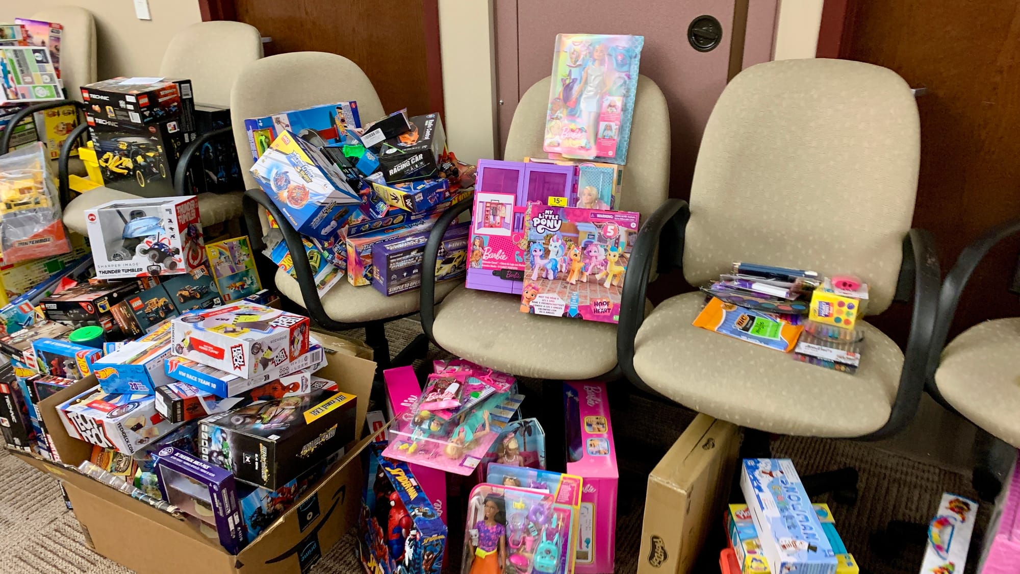 Piles of donated toys at the donations center for the KidsPeace Angel Tree holiday gift drive.