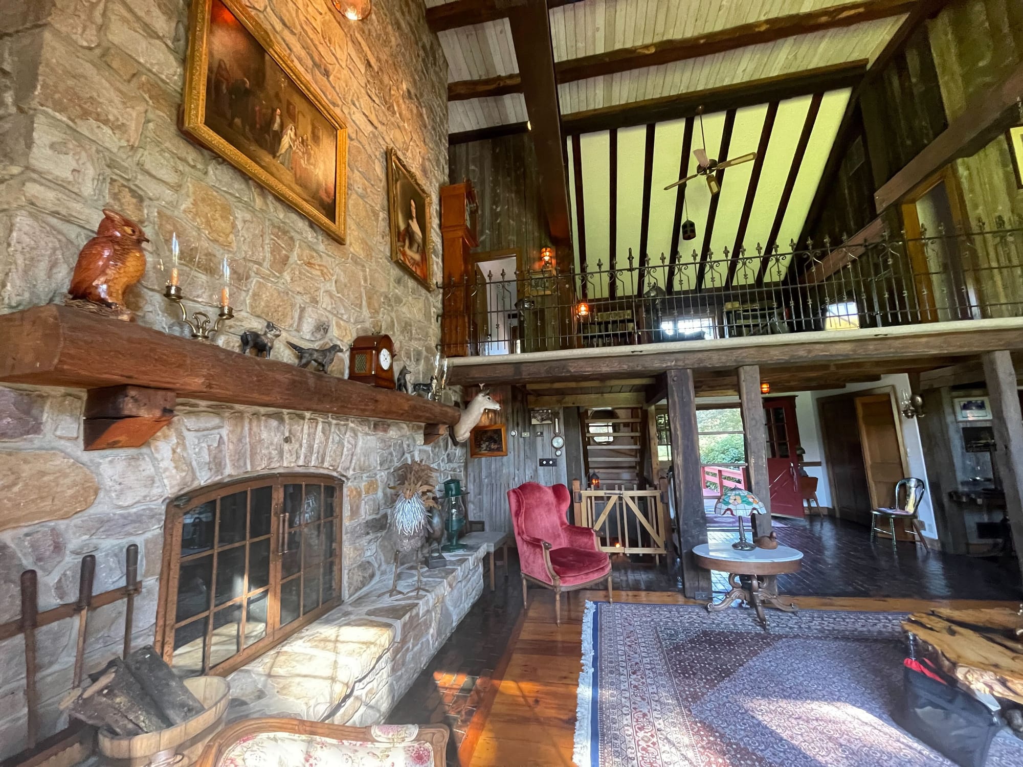 The living room features a fireplace that extends three stories
