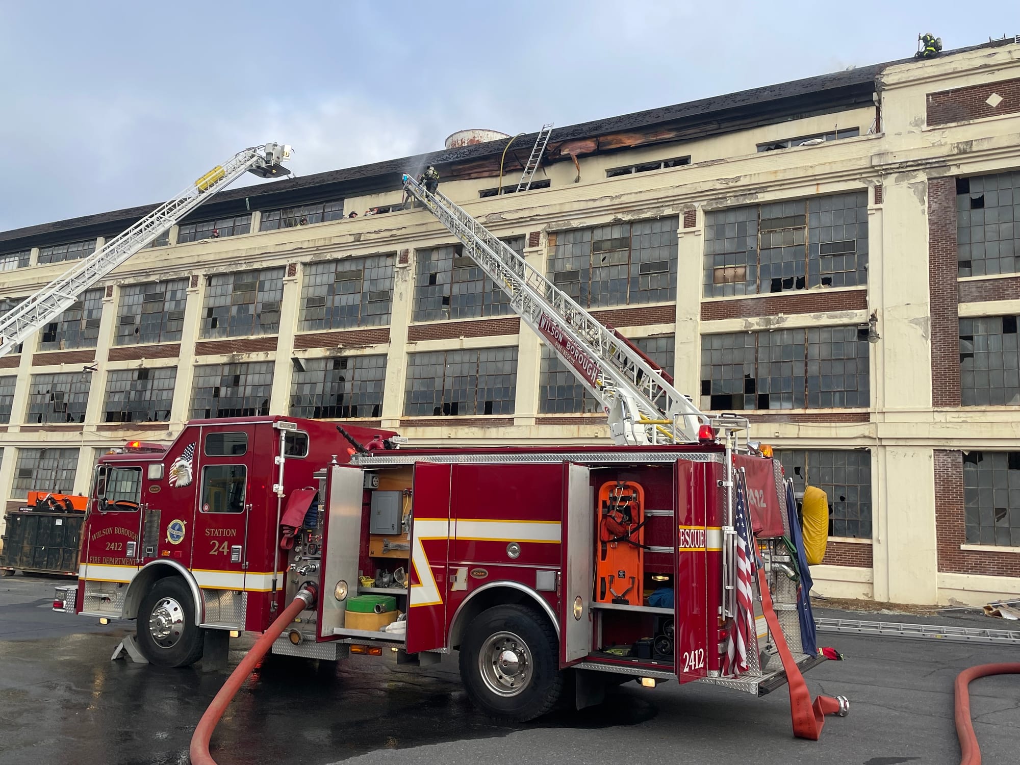 Firefighters respond to the old Dixie Cup building Friday morning after flames broke out in the structure. The fire was dispa