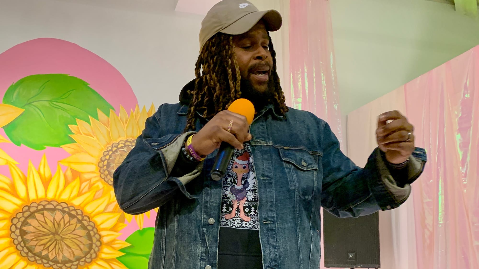 Bethlehem-based artist Quartez Larell performs during the 'Restoring Petals' reception.
