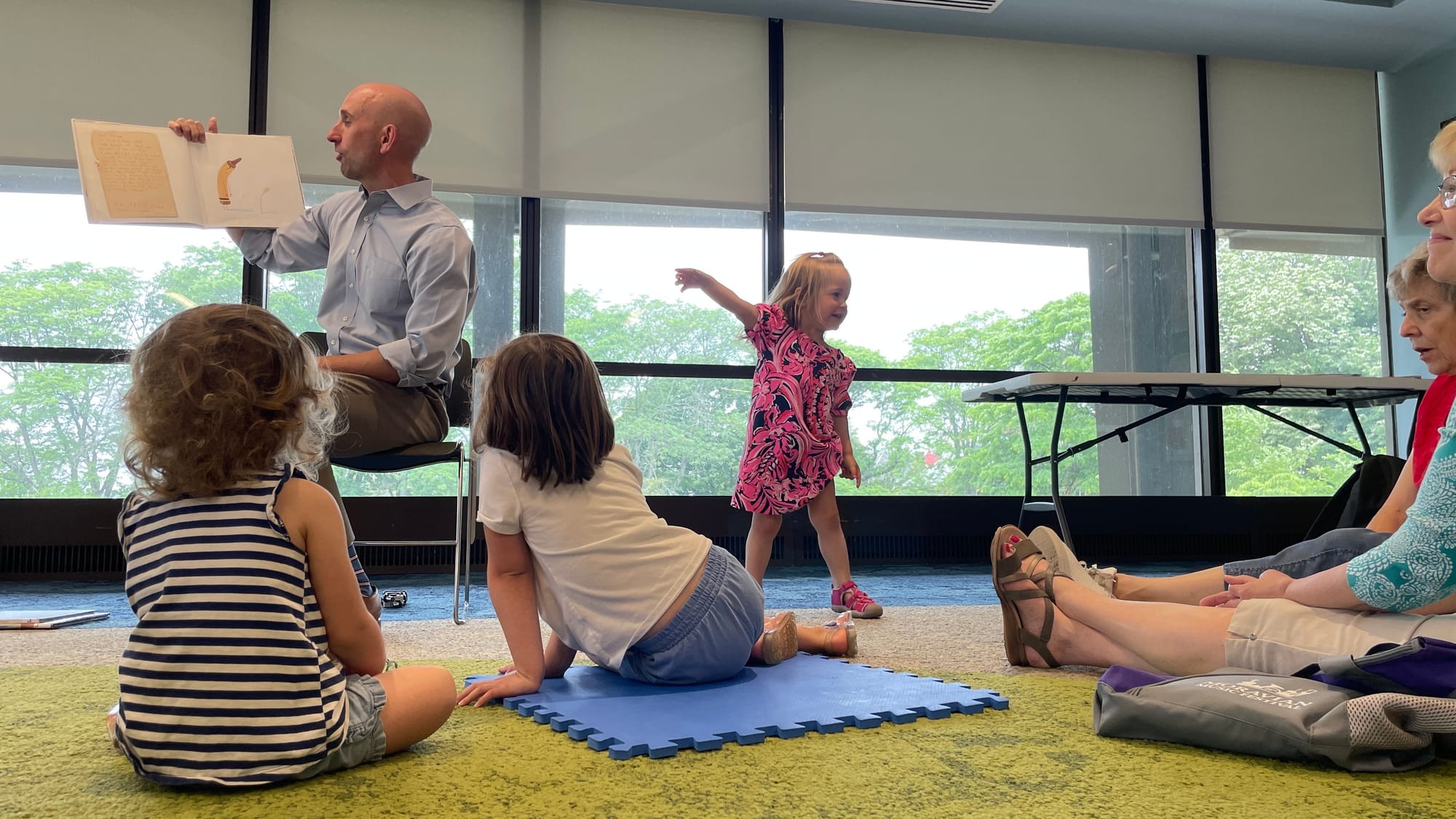 Bethlehem Mayor J. William Reynolds reads to kids at the library. Some children were vocal during the occasion, sometimes hop