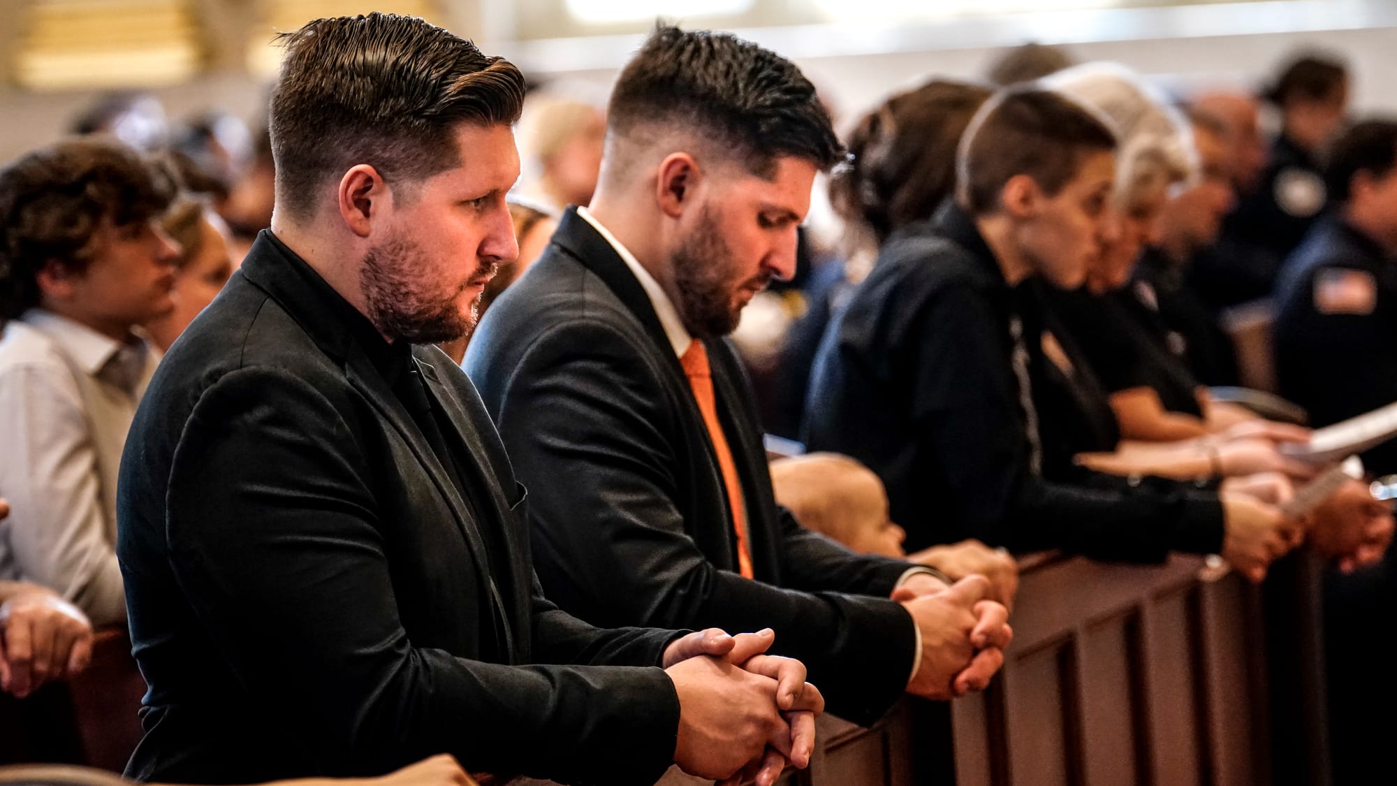 The family of Chris Kiskeravage during services. A Mass of Christian Burial was held at the Cathedral of St. Catharine of Sie