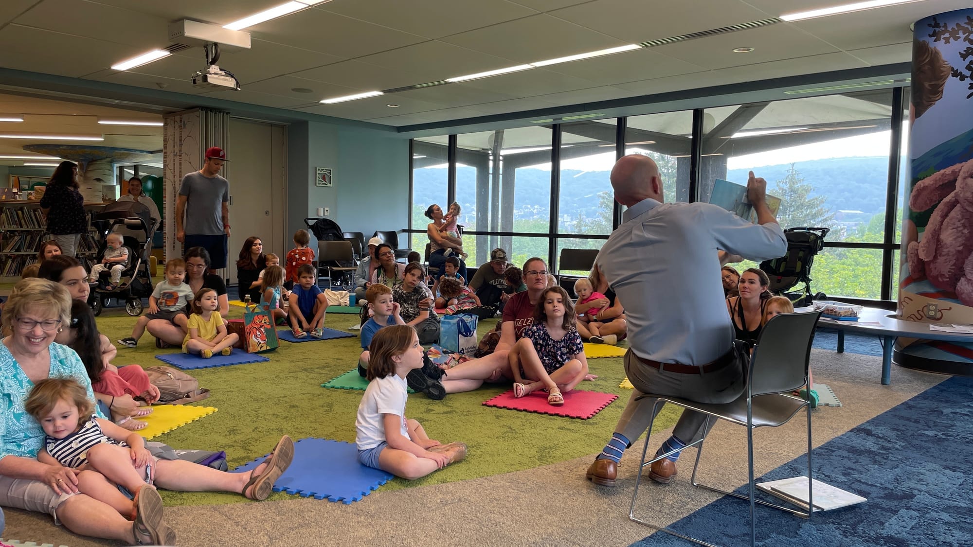 Bethlehem Mayor J. William Reynolds reads to kids at the library. The kids learned about communication and self-care, with th