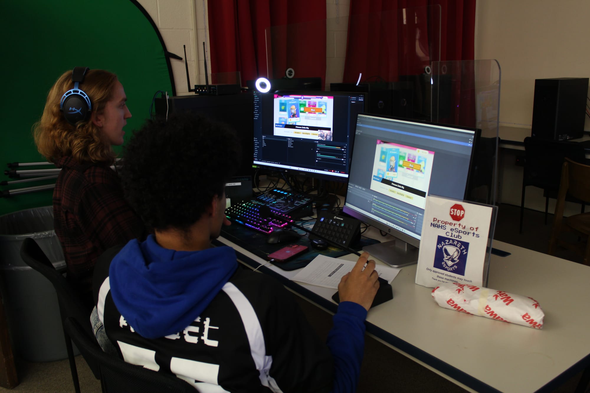 Students Genesis McCall and Tristan Reiser and managing the Super Smash Bros. Ultimate stream for Nazareth Area High School E